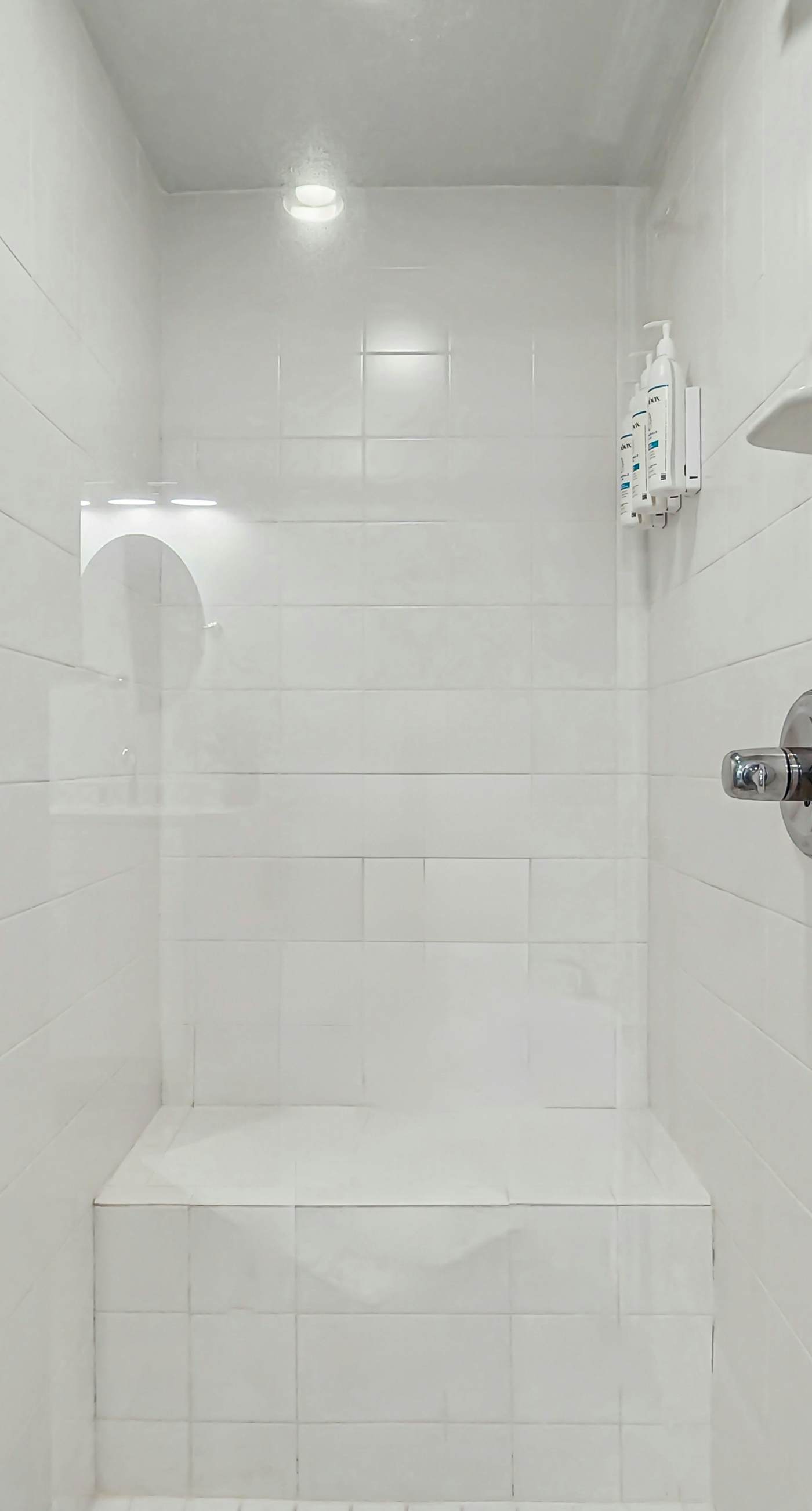 Gulf-front condo with balcony and access to pools, hot tub, gym, & private beach