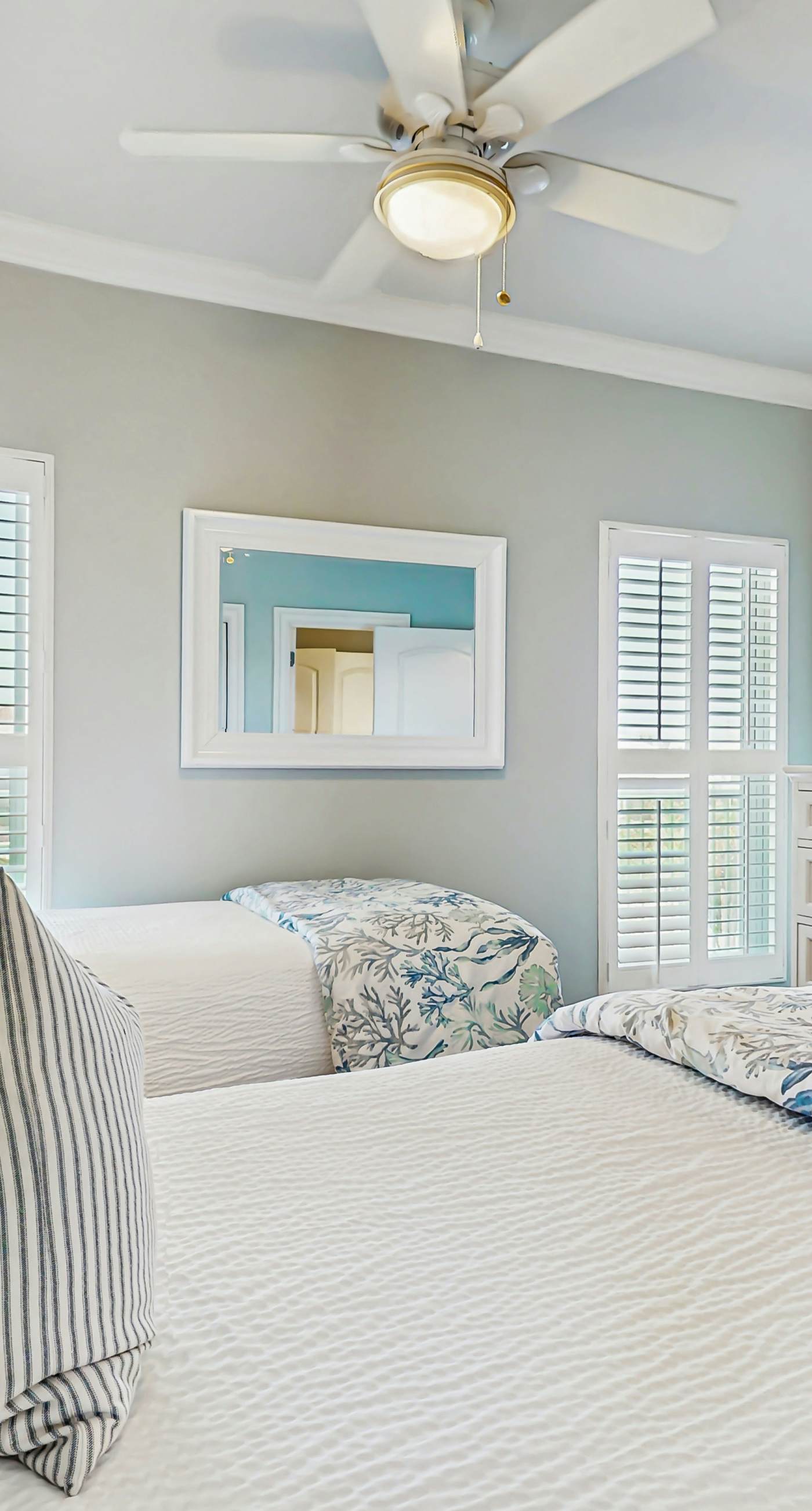 Gulf-front condo with balcony and access to pools, hot tub, gym, & private beach