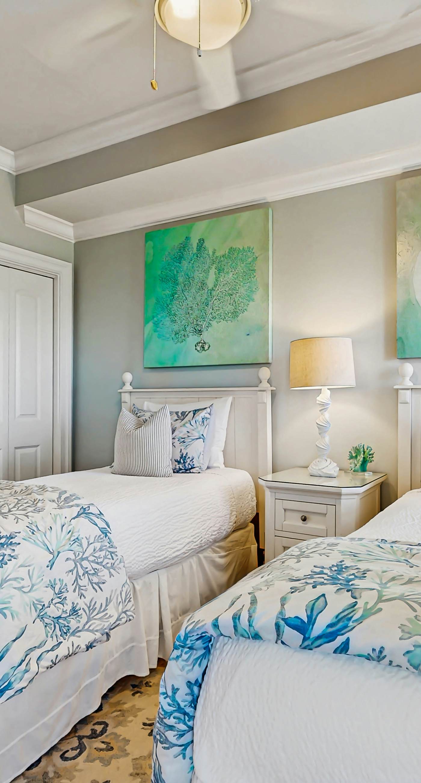 Gulf-front condo with balcony and access to pools, hot tub, gym, & private beach