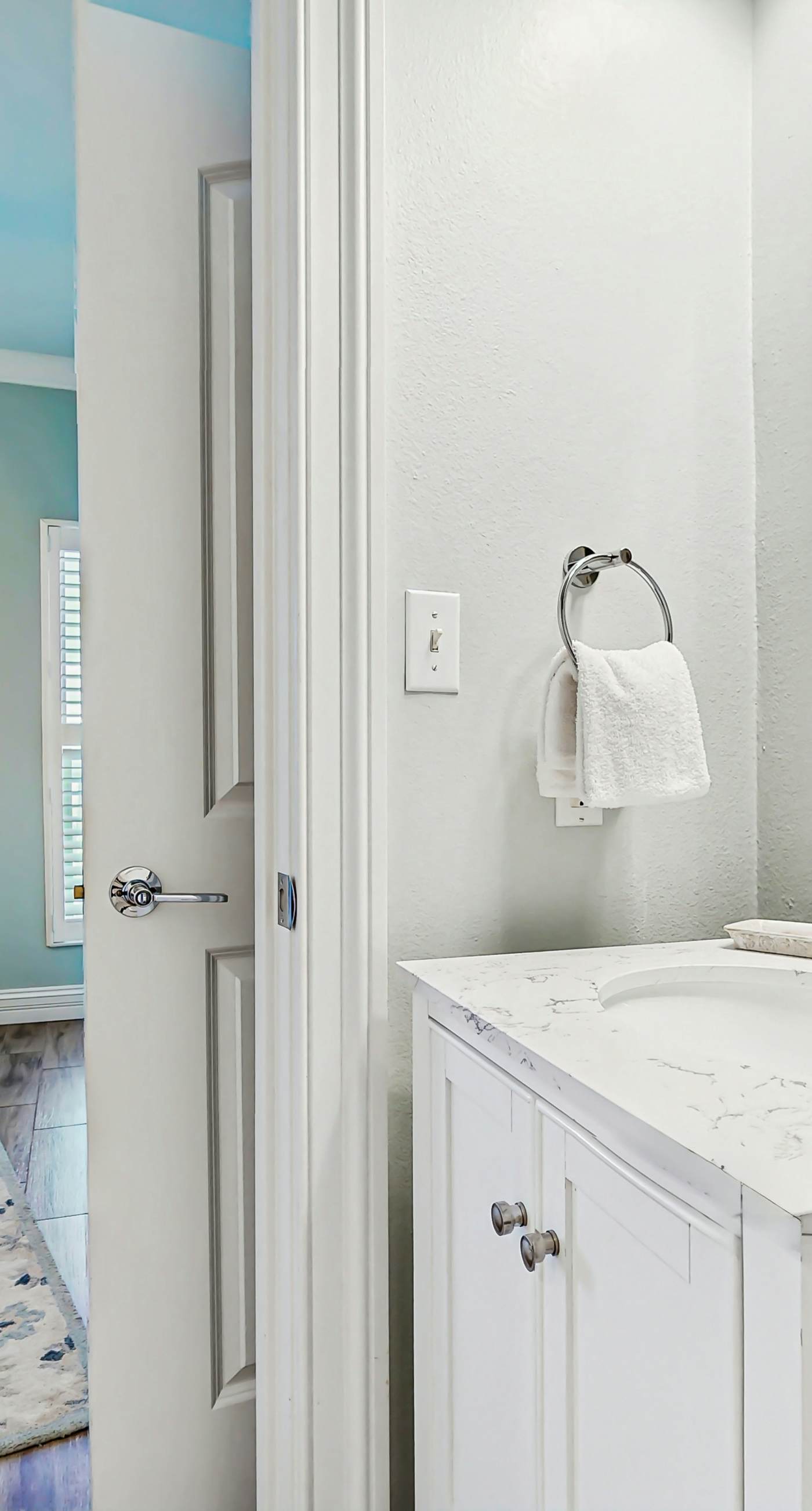 Gulf-front condo with balcony and access to pools, hot tub, gym, & private beach