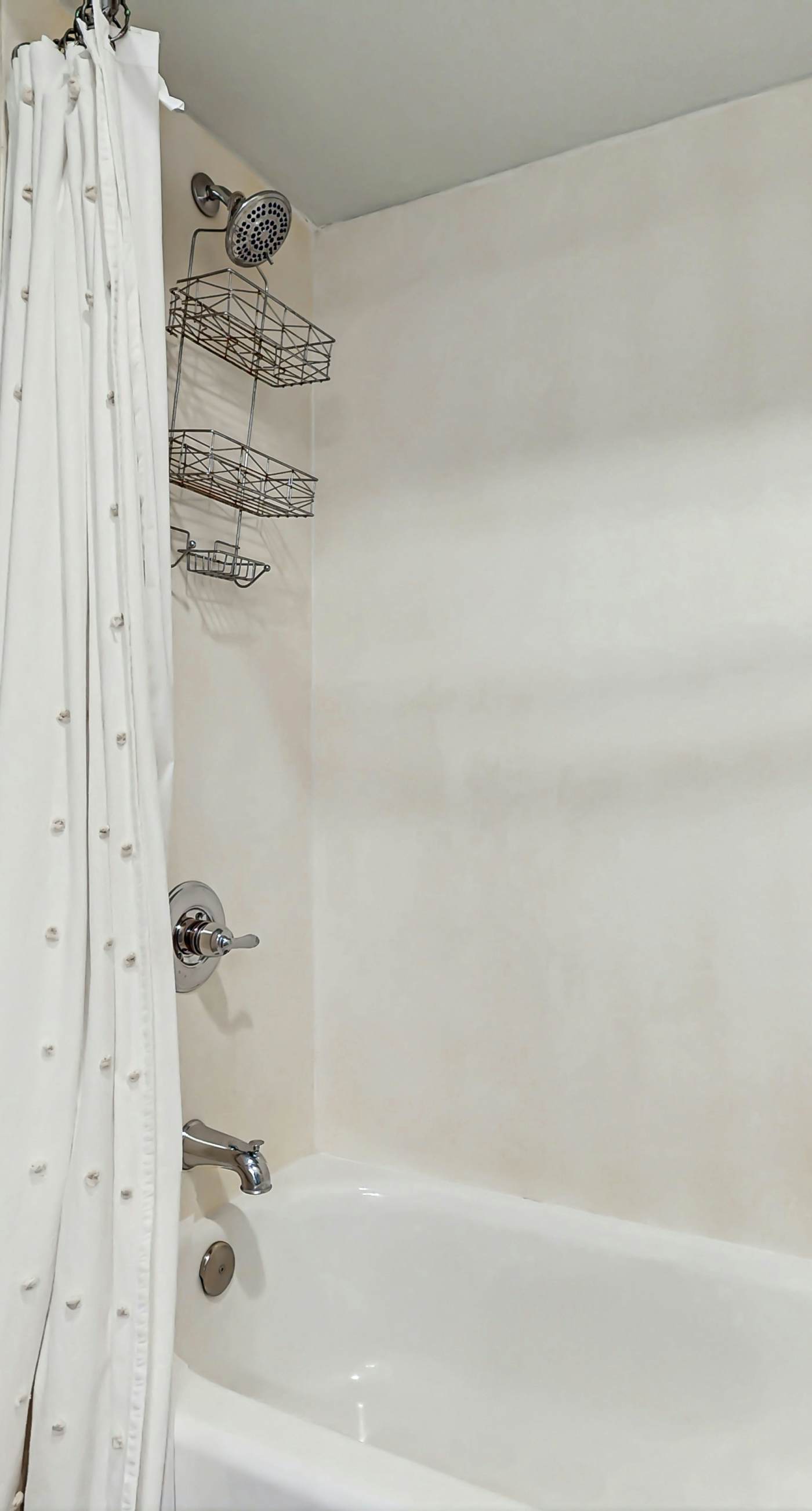 Gulf-front condo with balcony and access to pools, hot tub, gym, & private beach