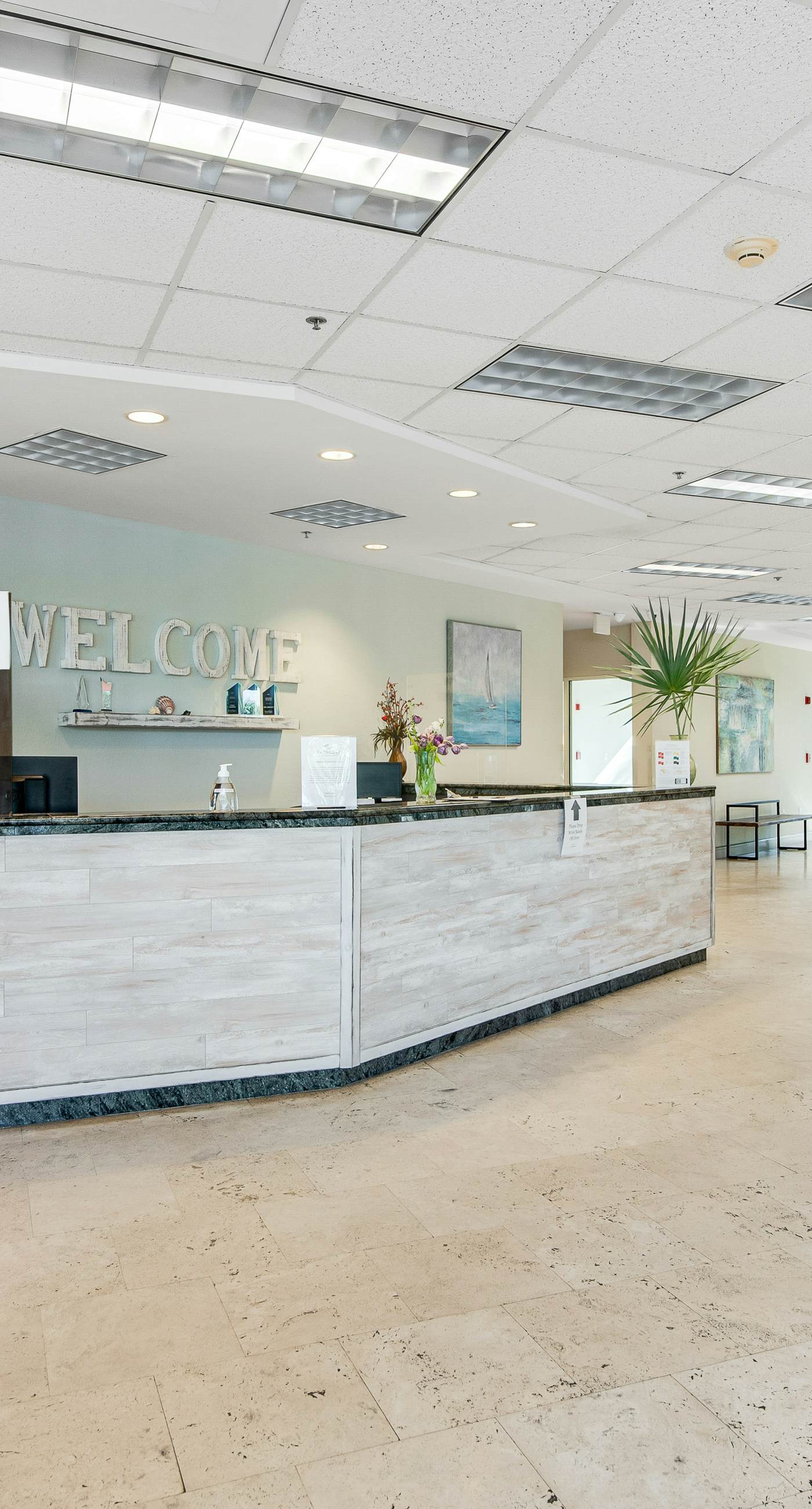 Gulf-front condo with balcony and access to pools, hot tub, gym, & private beach