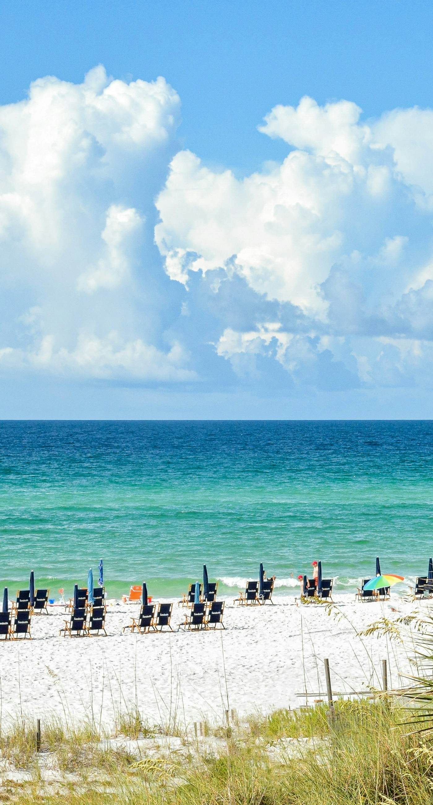 Gorgeous waterfront dog-friendly Villa with patio, deck, golf cart & shared pool