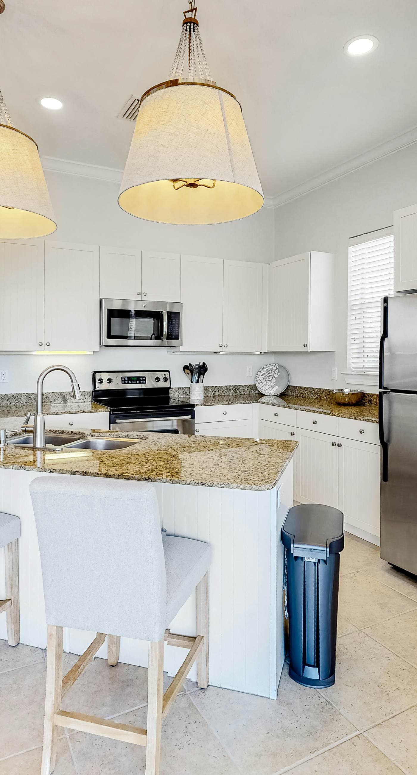 Lakefront condo with water-view balcony, private golf cart, resort pool & amenities