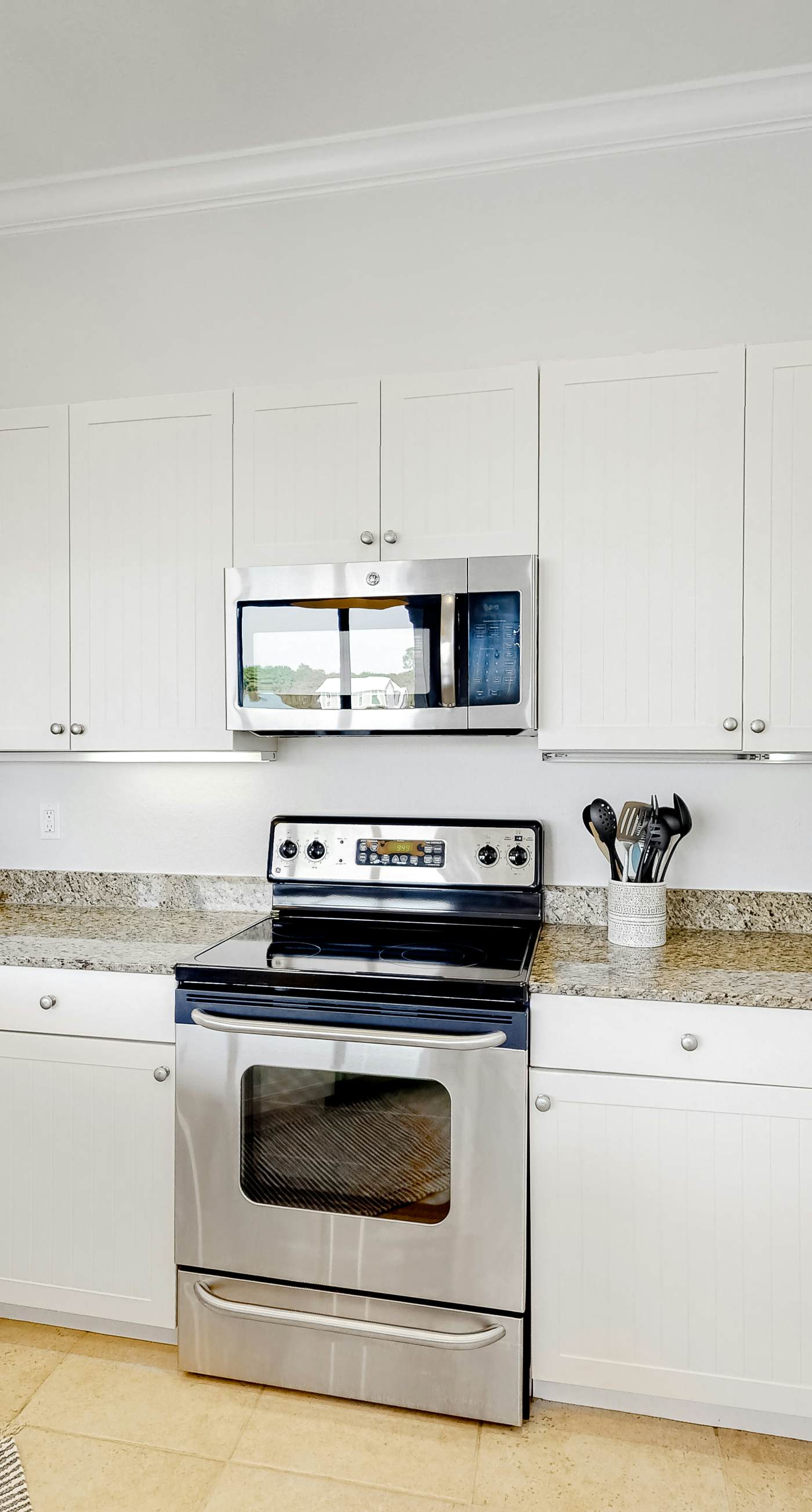 Lakefront condo with water-view balcony, private golf cart, resort pool & amenities