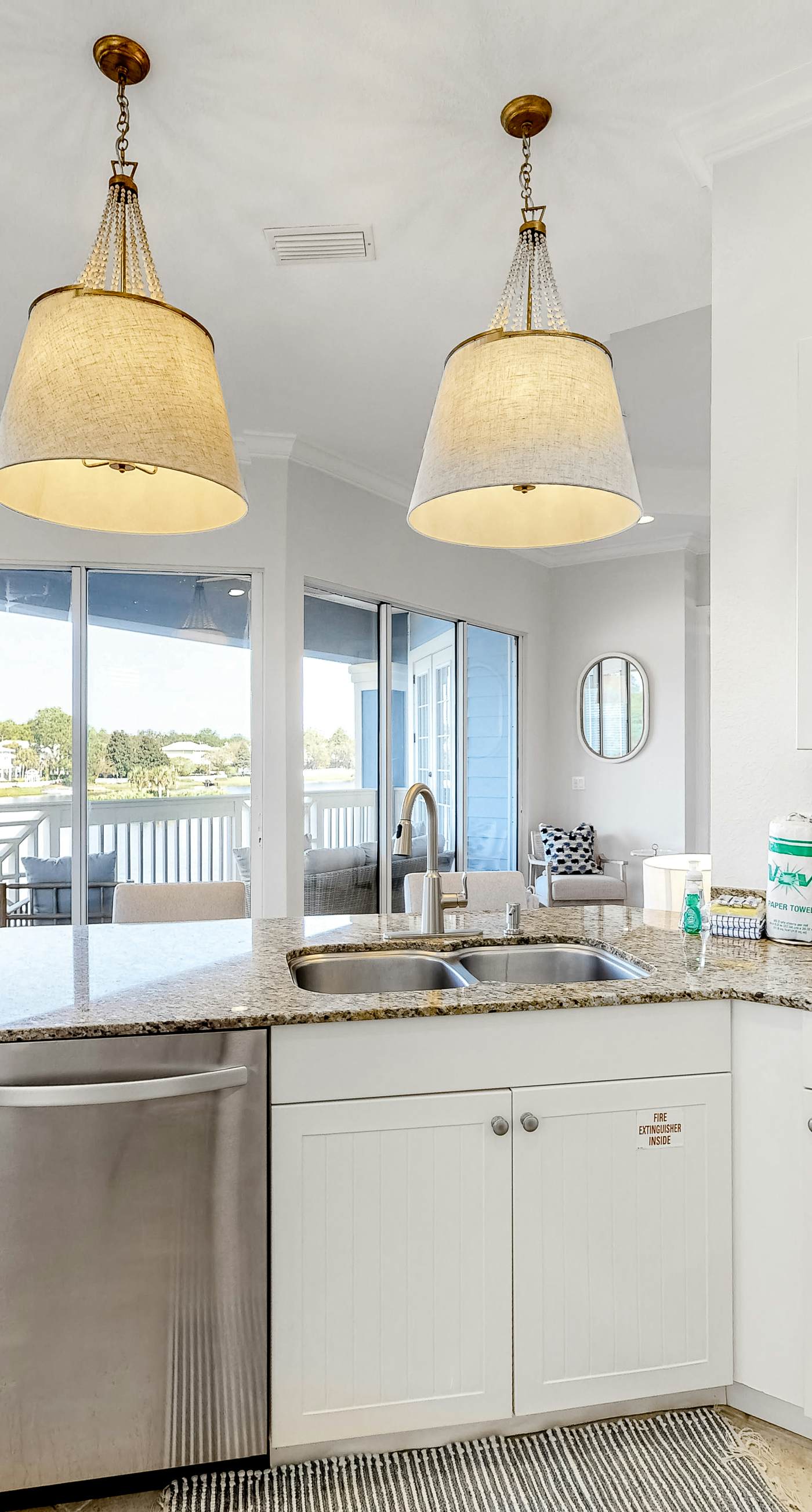 Lakefront condo with water-view balcony, private golf cart, resort pool & amenities