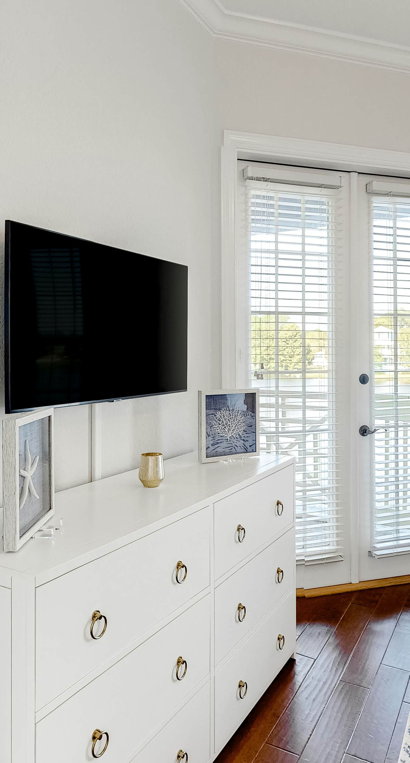 Lakefront condo with water-view balcony, private golf cart, resort pool & amenities