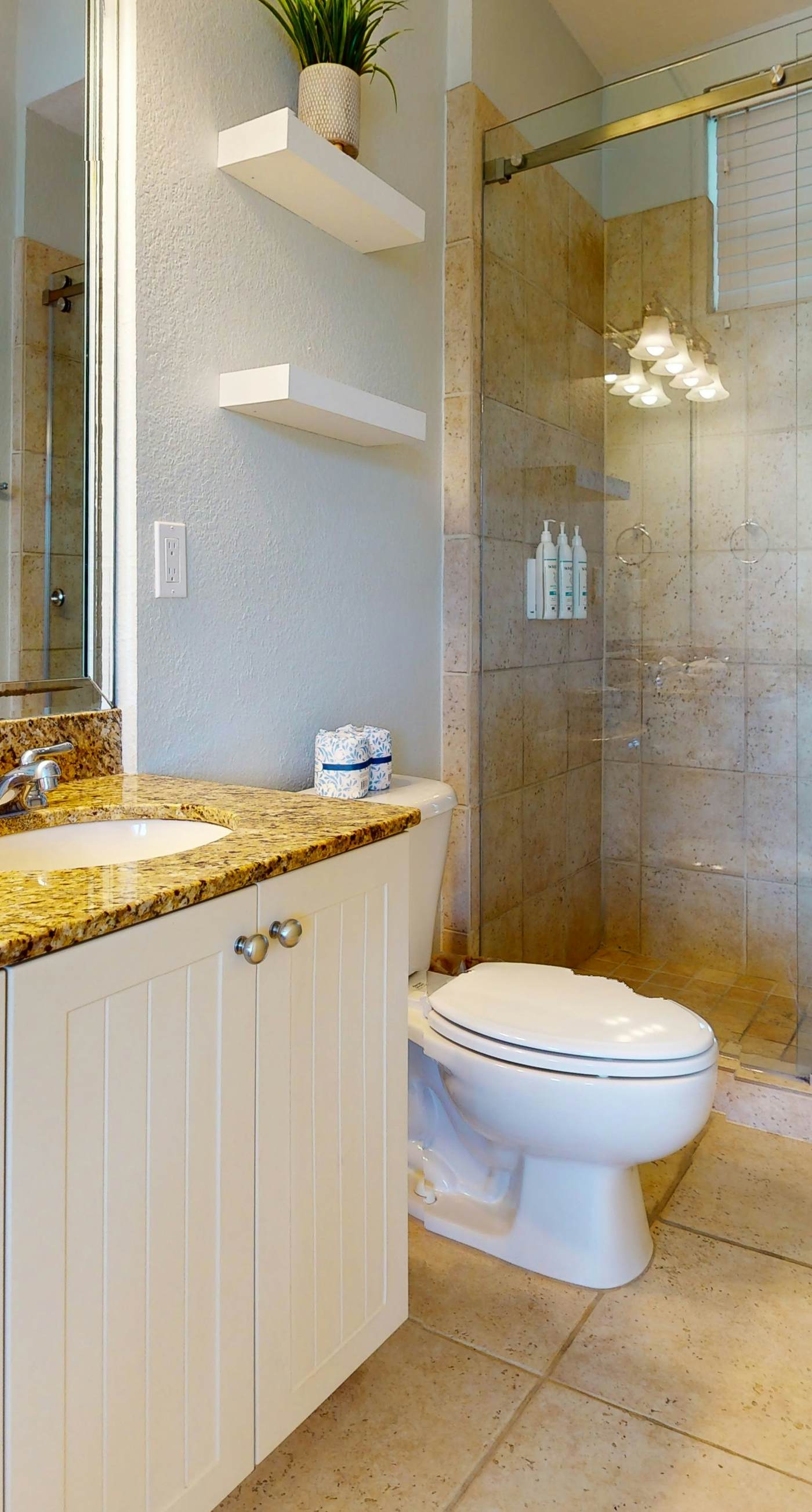 Lakefront condo with water-view balcony, private golf cart, resort pool & amenities