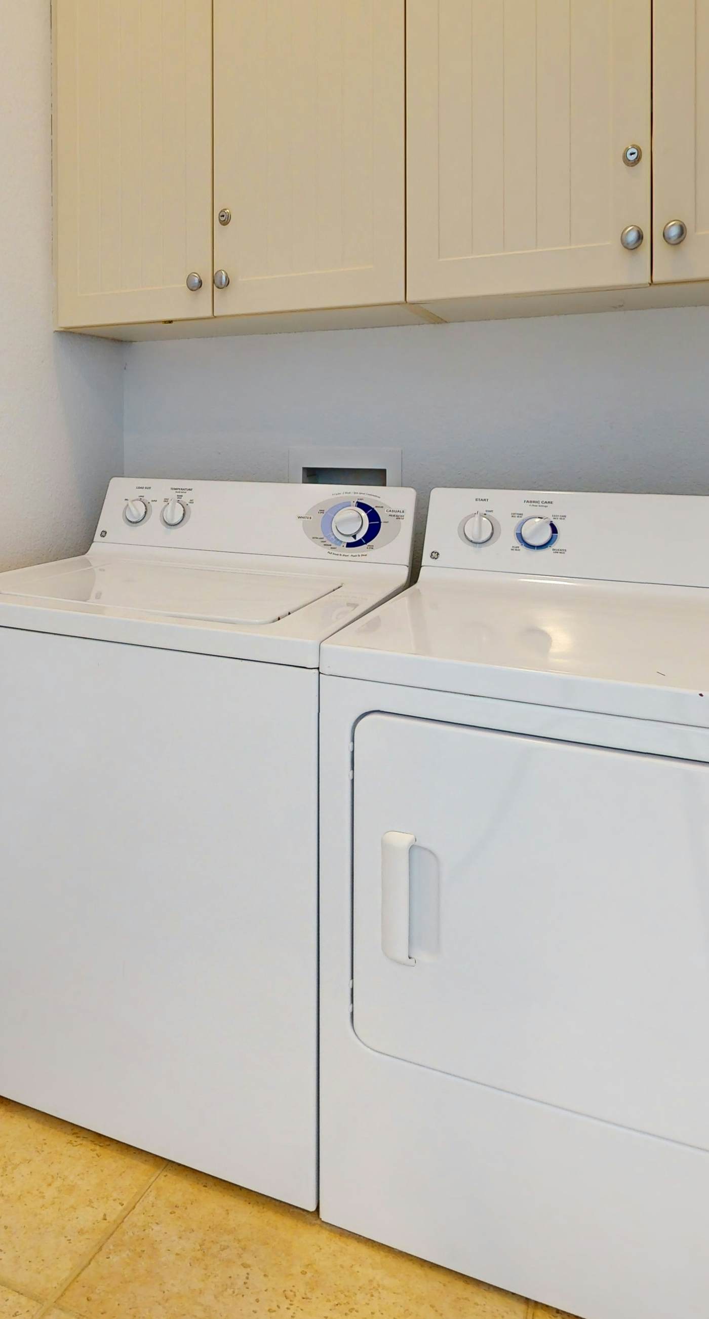 Lakefront condo with water-view balcony, private golf cart, resort pool & amenities