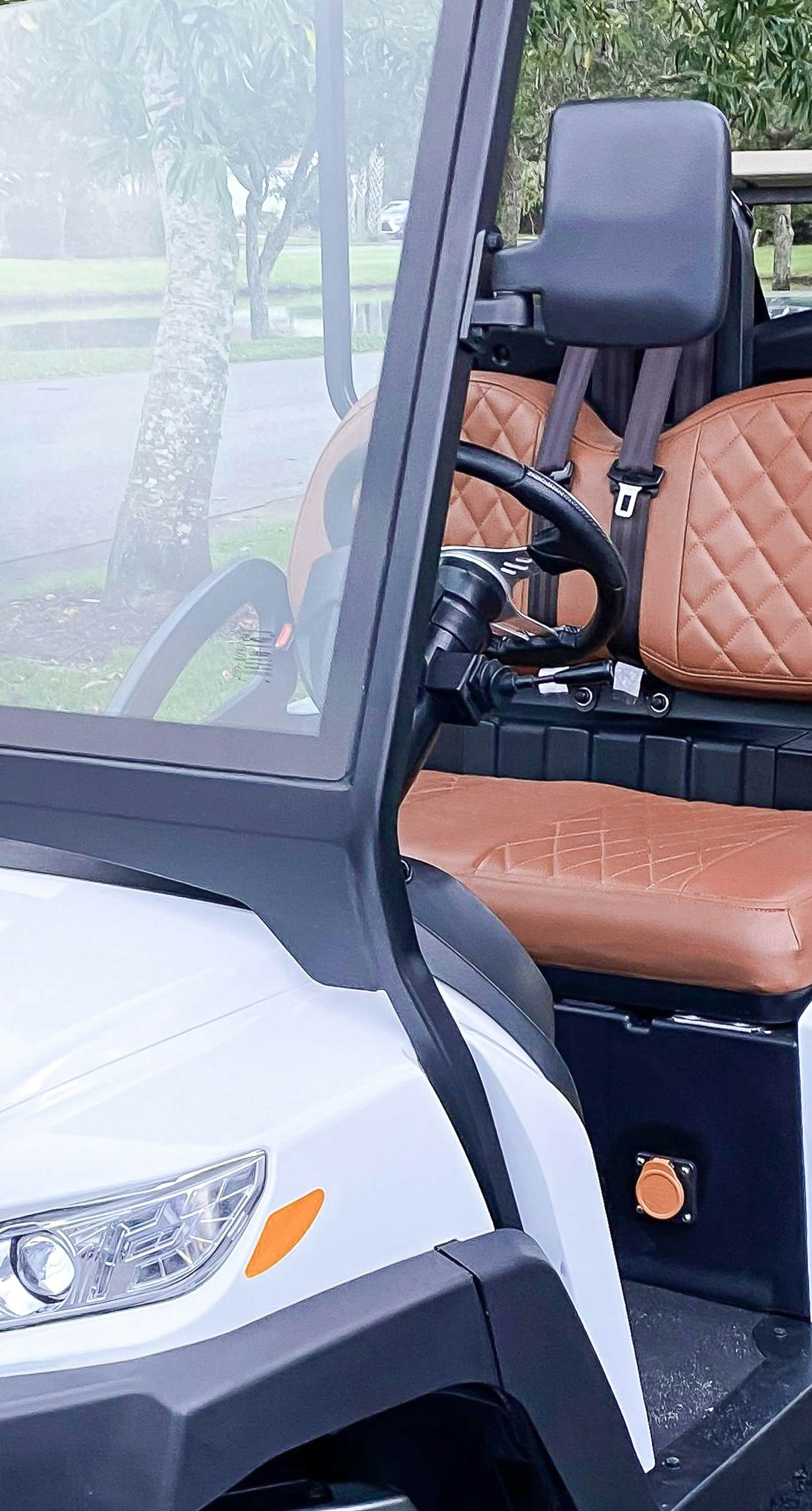 Lakefront condo with water-view balcony, private golf cart, resort pool & amenities