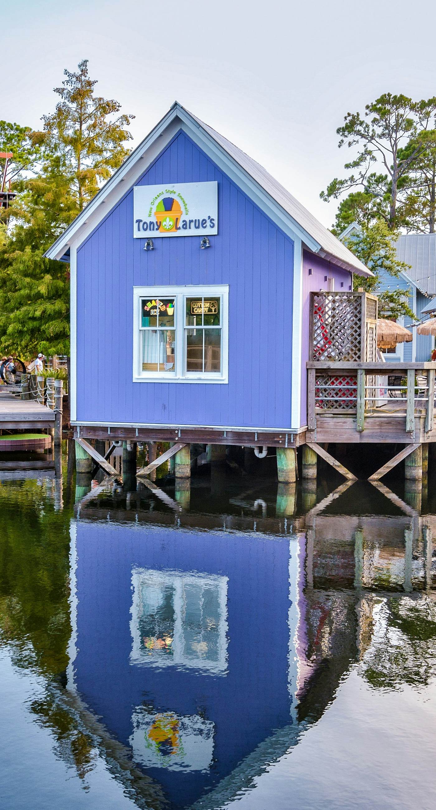 Lakefront condo with water-view balcony, private golf cart, resort pool & amenities