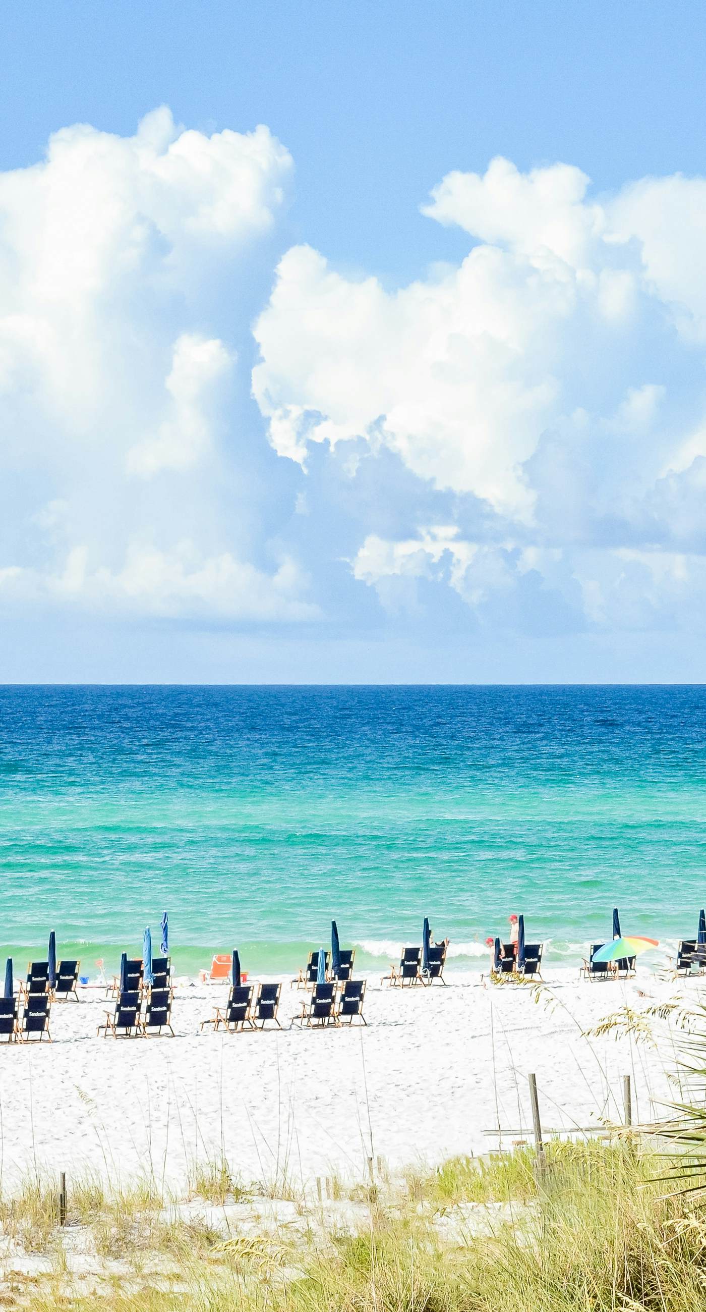 Lakefront condo with water-view balcony, private golf cart, resort pool & amenities