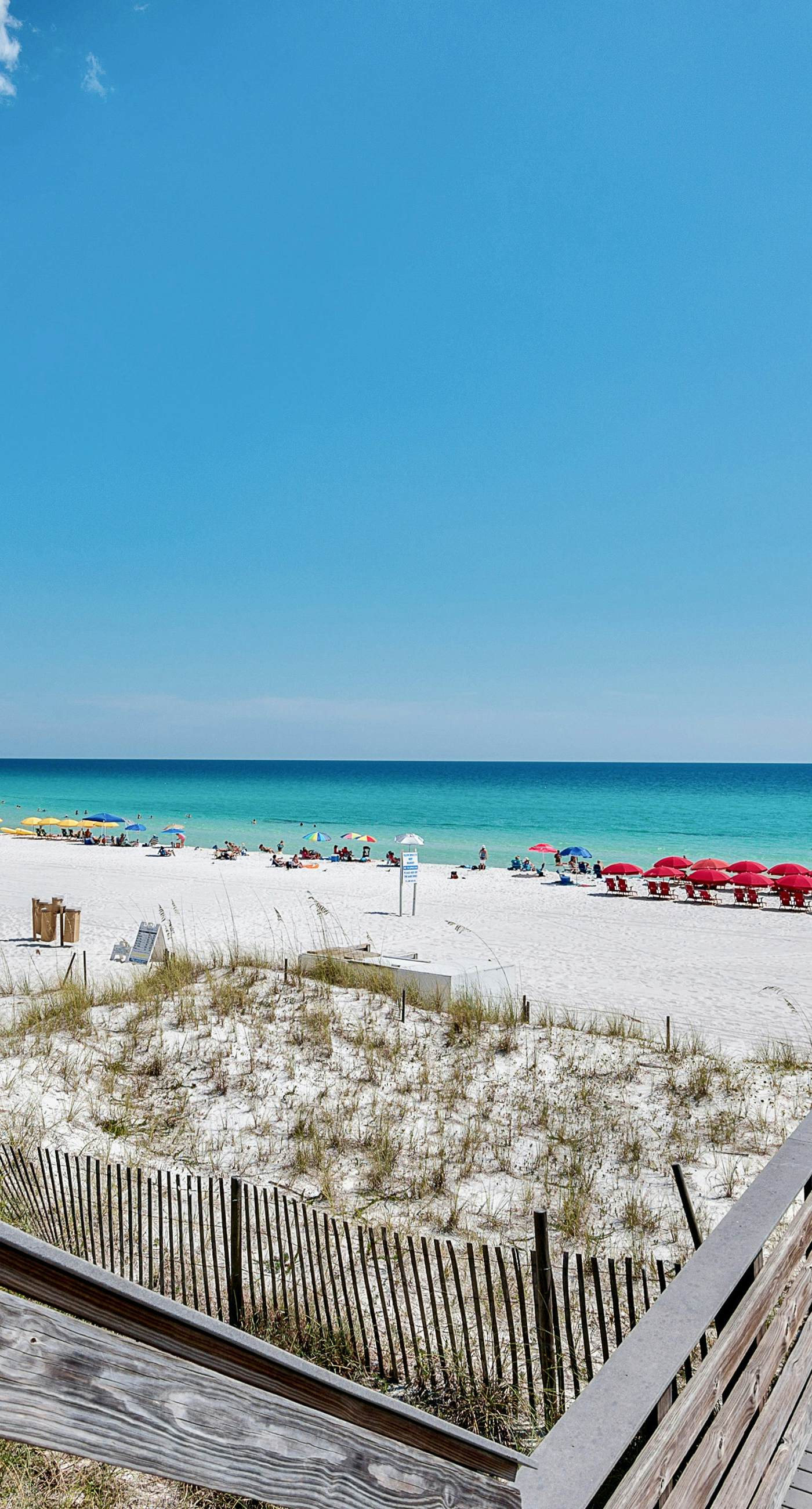 Lakefront condo with water-view balcony, private golf cart, resort pool & amenities