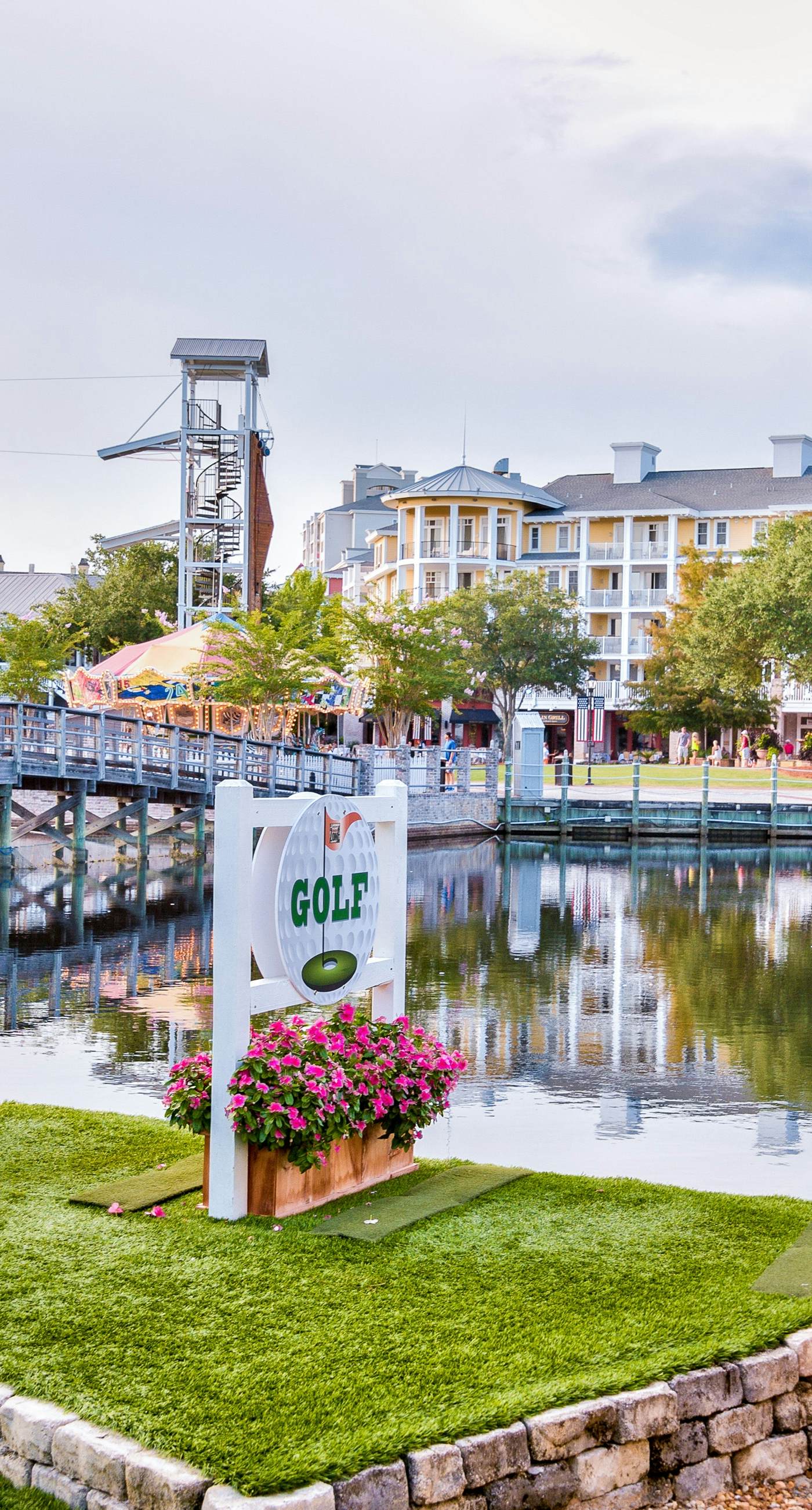 Lakefront condo with water-view balcony, private golf cart, resort pool & amenities