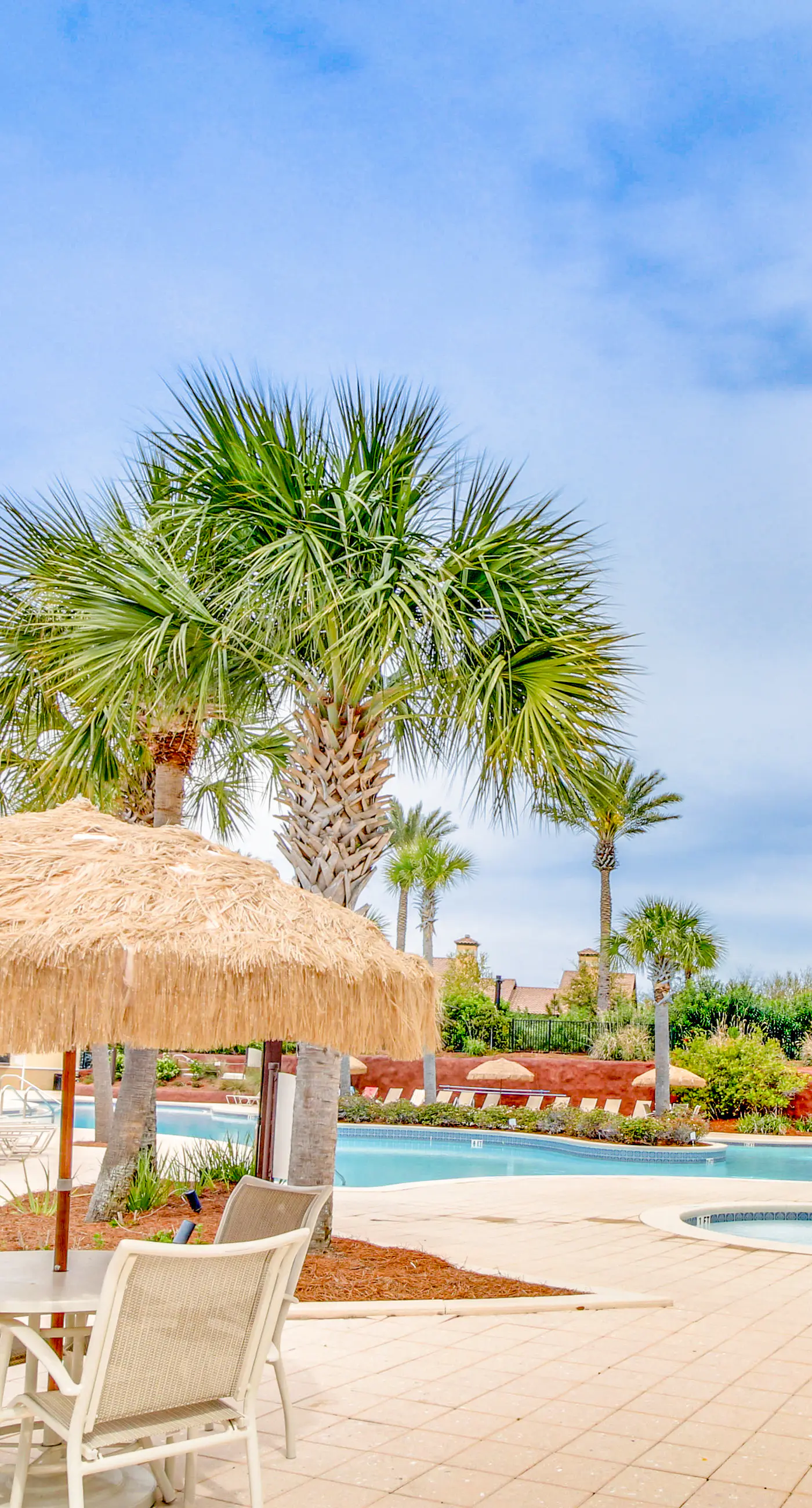 Ocean-view condo with wraparound balcony, W/D, pool, & hot tub