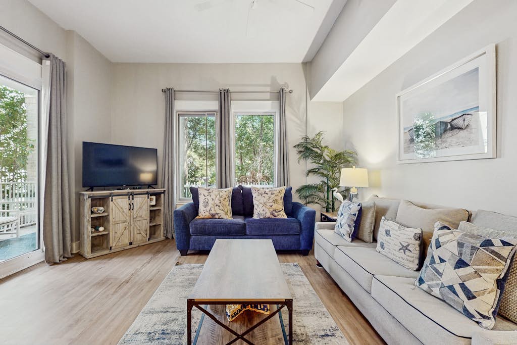 First-floor condo with a kitchen, patio, pool, hot tub, grill