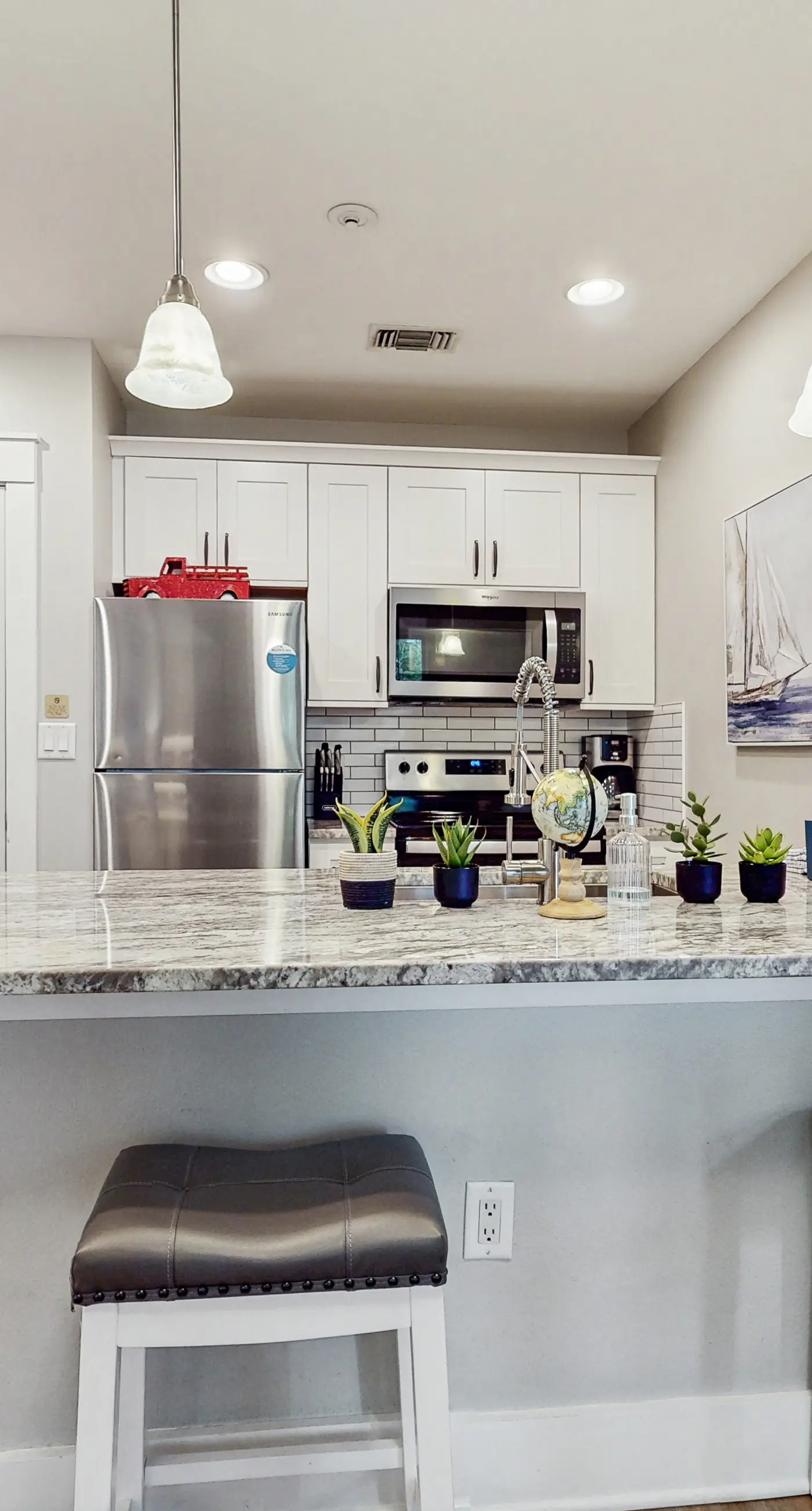 First-floor condo with a kitchen, patio, pool, hot tub, grill, & spa access