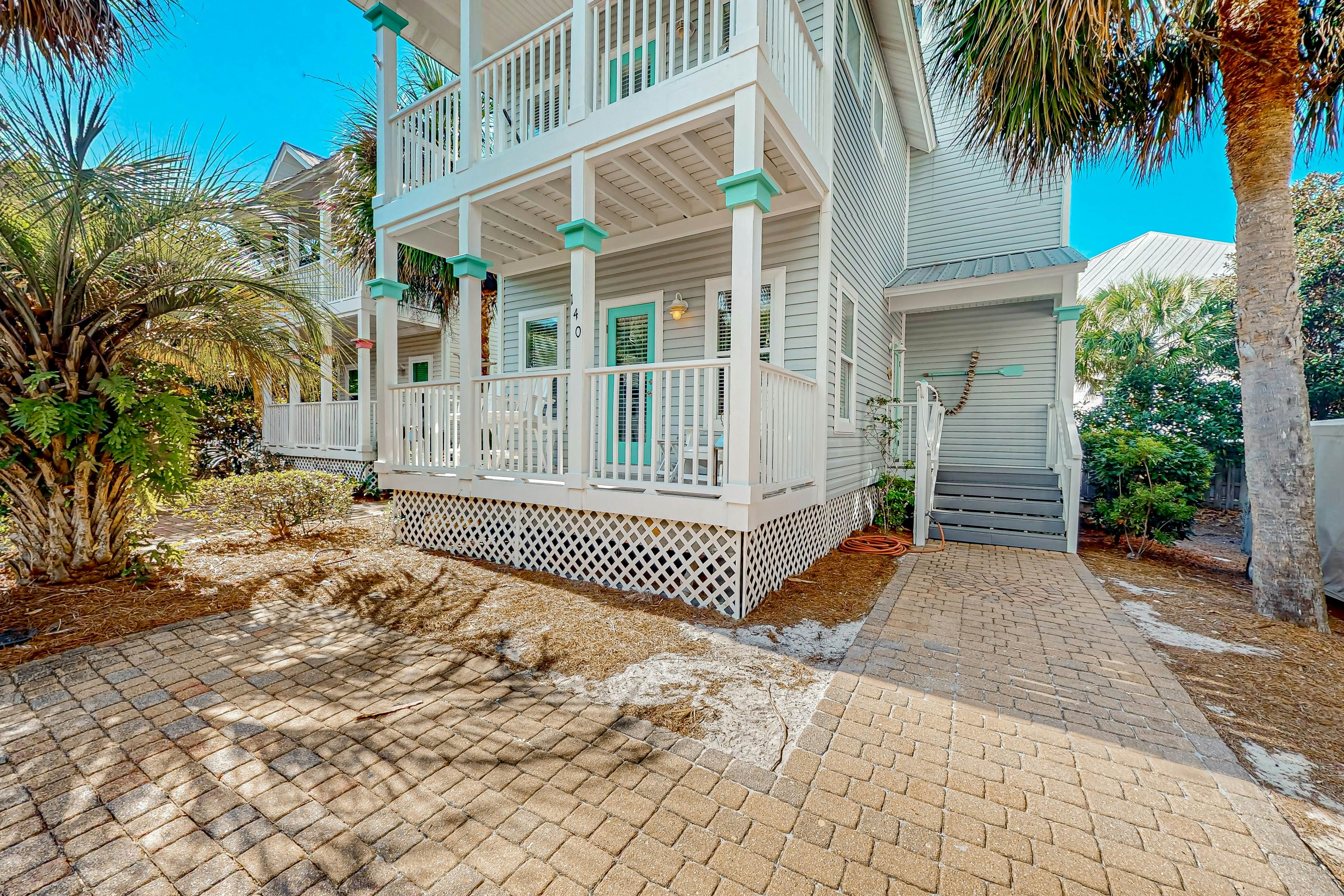 3-story home with heated outdoor pool, BBQ area, balconies, partial ocean views