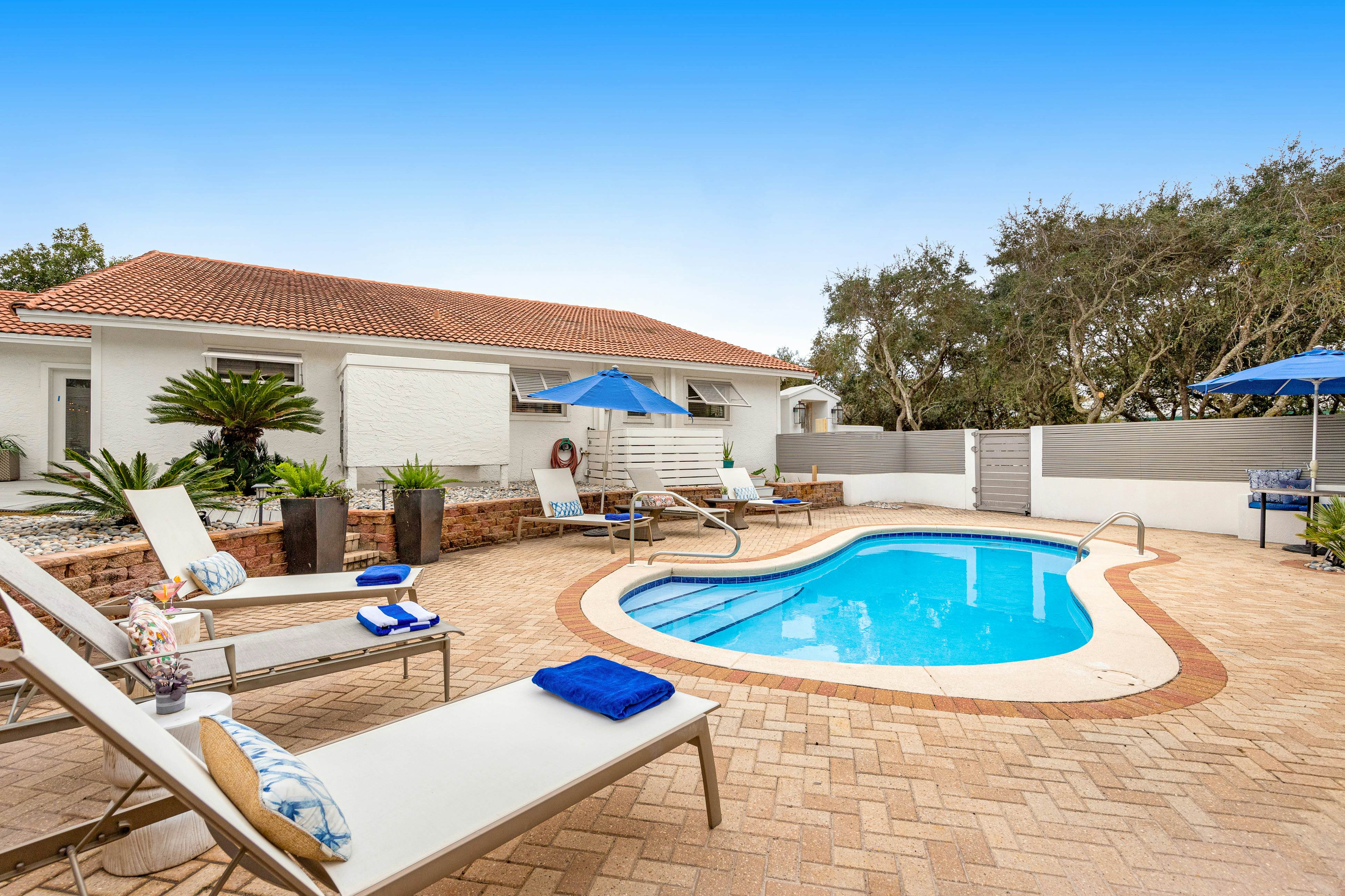 Enchanting ocean-view home with pool, bikes, balcony & private beach access