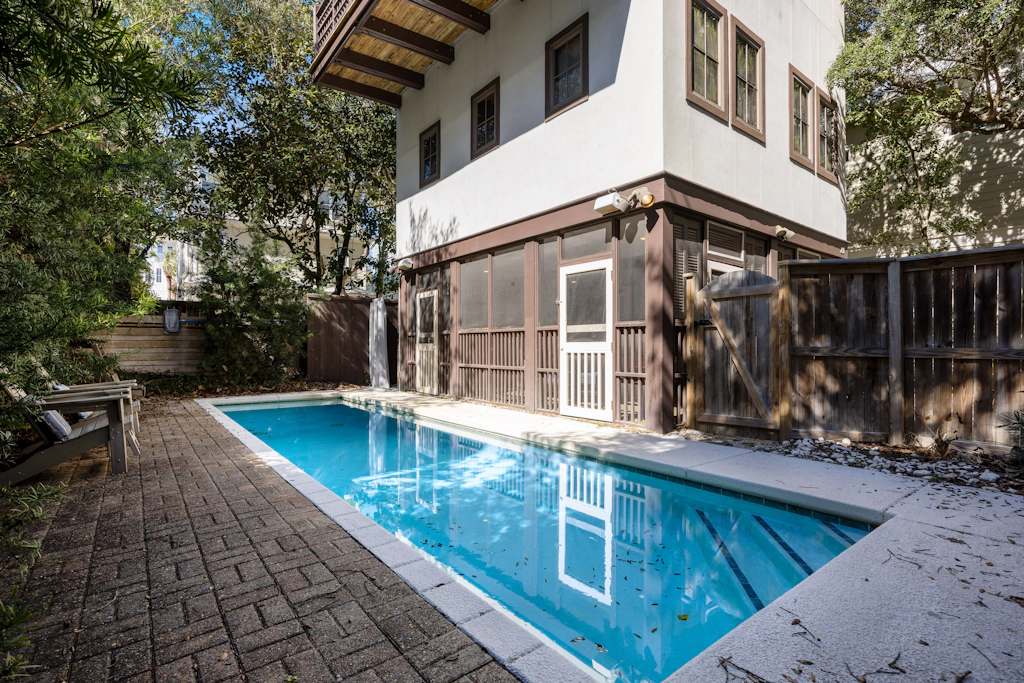 Home steps from the beach with plunge pool, gas grill, scenic balcony, & AC