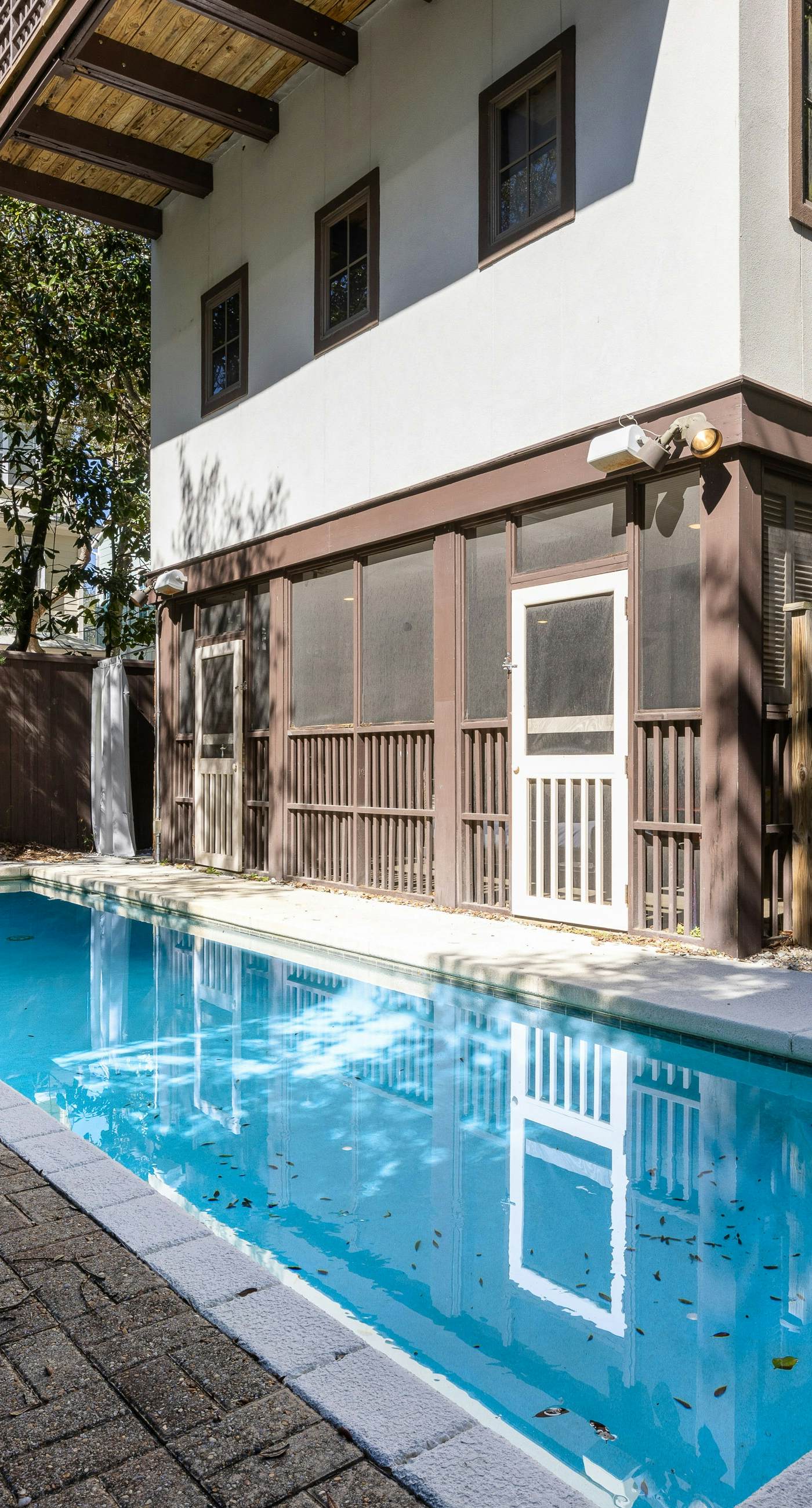Home steps from the beach with plunge pool, gas grill, scenic balcony, & AC