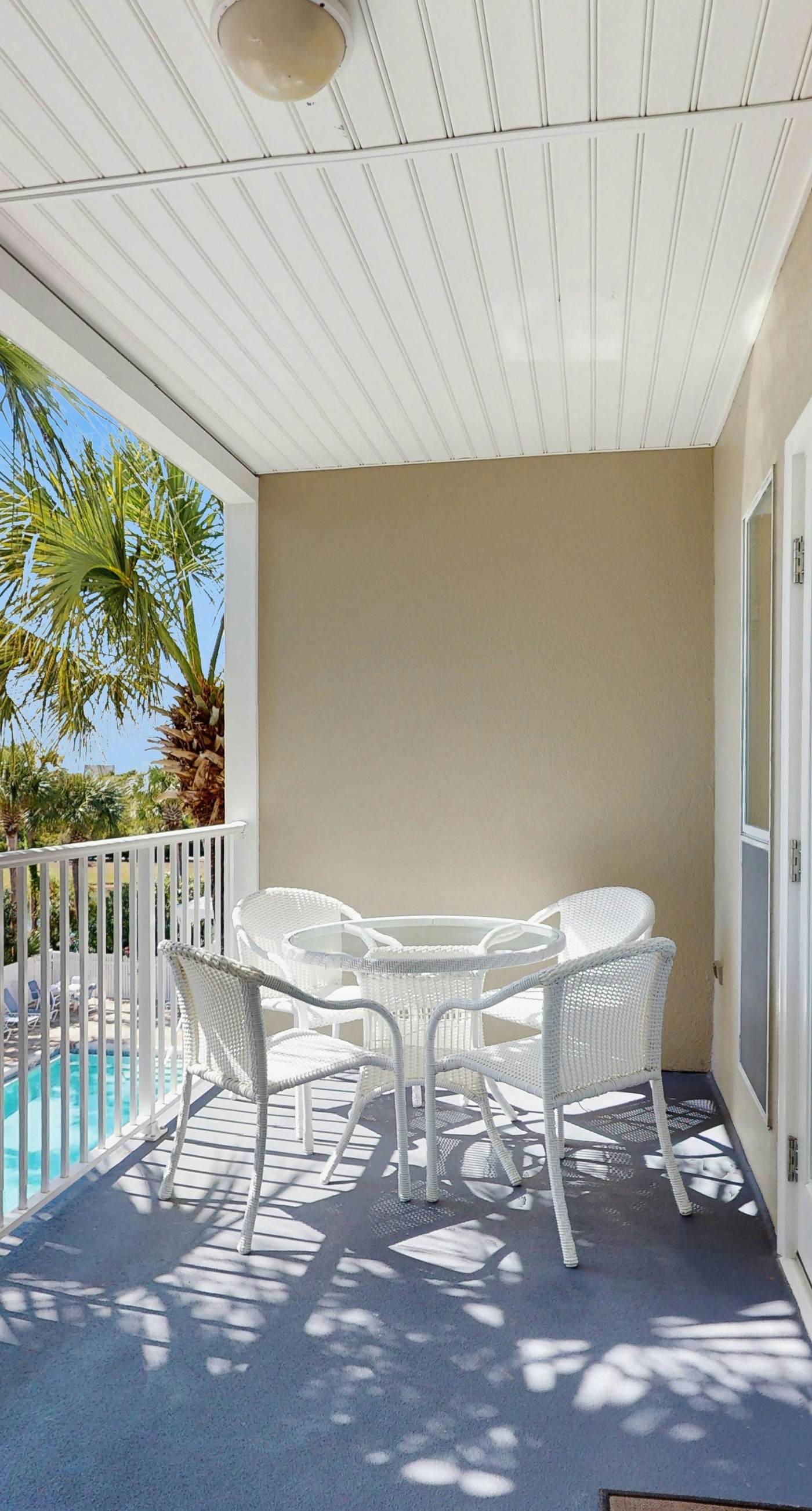 Bright, open 3rd-floor condo with pool views from private balcony - next to beach