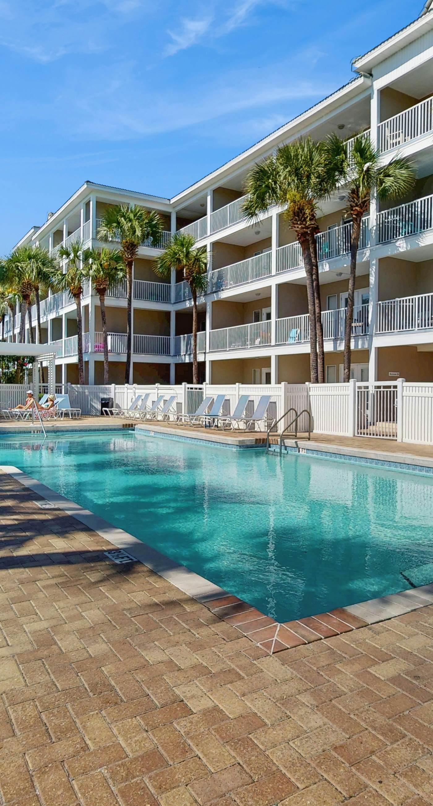 Bright, open 3rd-floor condo with pool views from private balcony - next to beach