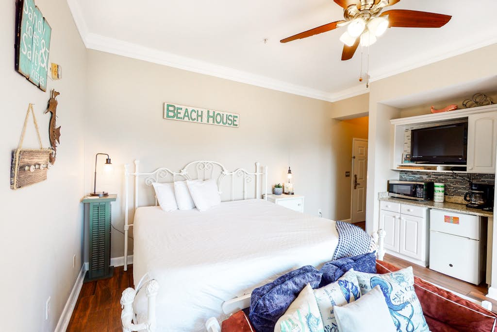 Experience the relaxed charm of a beach house paired with the ease and comfort of a hotel-style condo. Start your mornings on the private balcony, sipping coffee while taking in serene views of the ocean and the beautifully maintained community below. Beyond the sandy shoreline just steps away, guests also enjoy access to shared swimming pools and a soothing hot tub, creating the perfect blend of coastal escape and resort-style convenience.