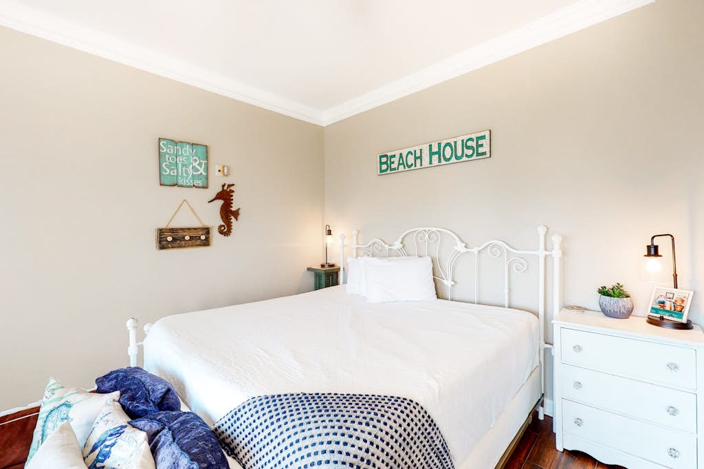 Experience the relaxed charm of a beach house paired with the ease and comfort of a hotel-style condo. Start your mornings on the private balcony, sipping coffee while taking in serene views of the ocean and the beautifully maintained community below. Beyond the sandy shoreline just steps away, guests also enjoy access to shared swimming pools and a soothing hot tub, creating the perfect blend of coastal escape and resort-style convenience.