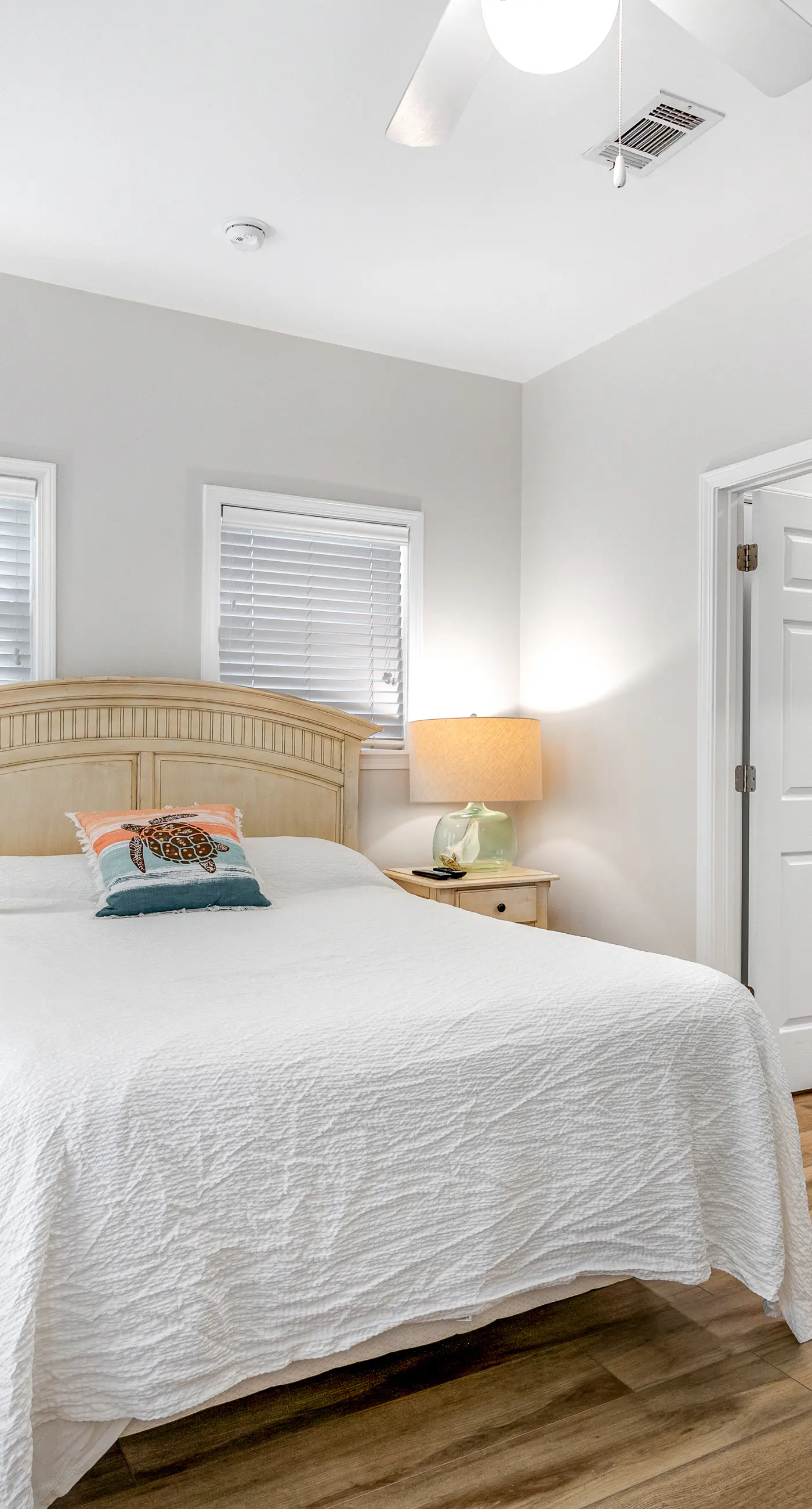 Charming getaway with lovely porches & shared pool - walk to the beach