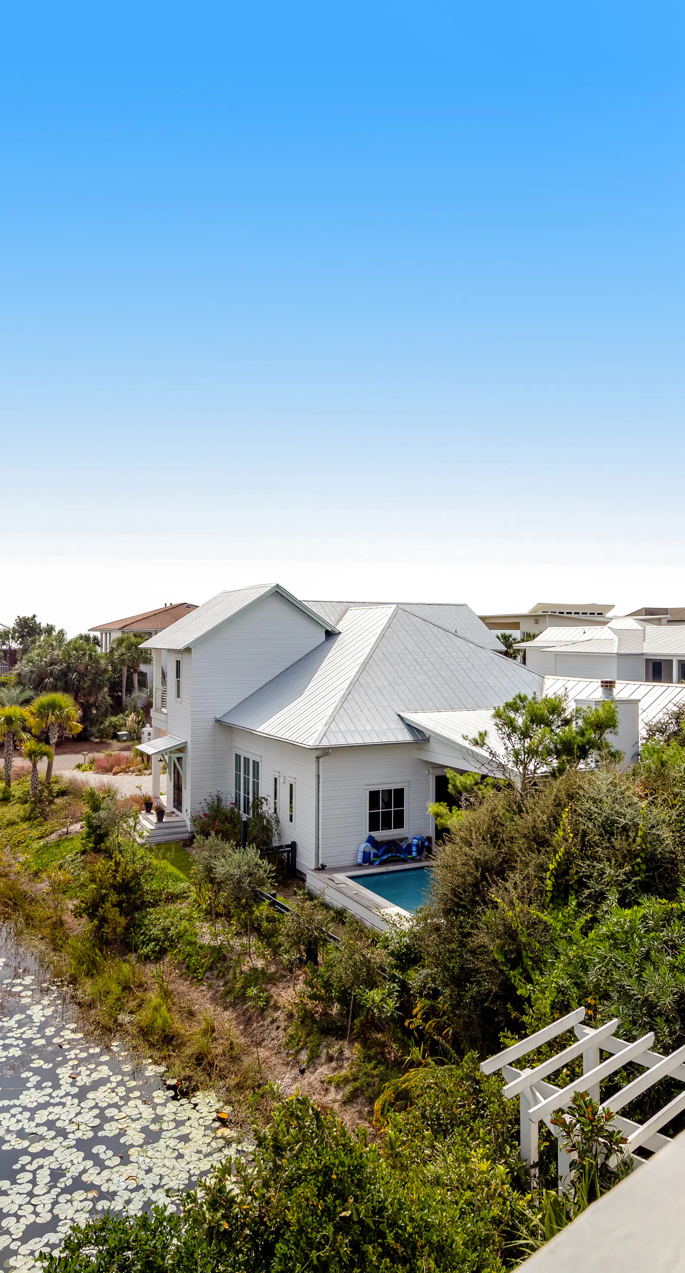 Charming getaway with lovely porches & shared pool - walk to the beach