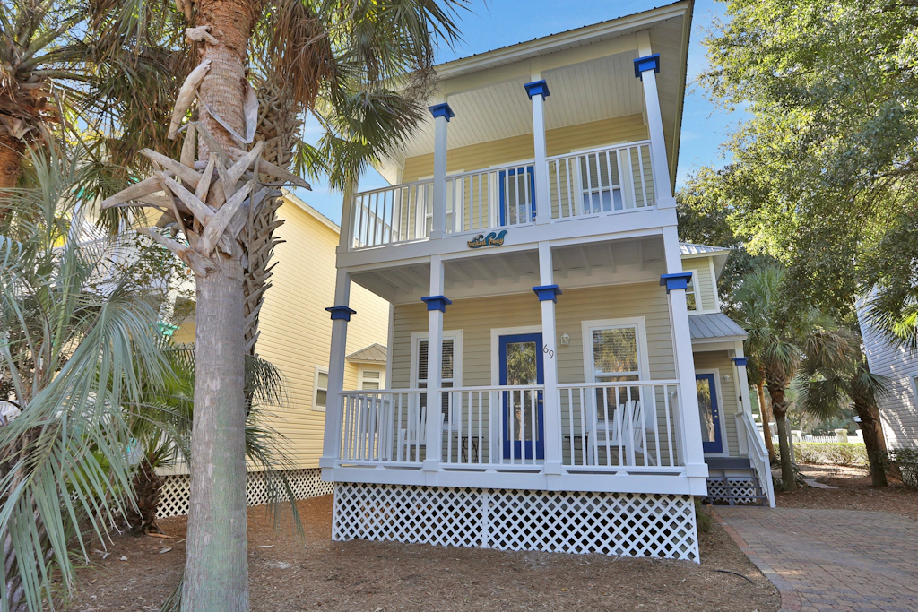 Two-story home near the beach with private balconies & on-site pool