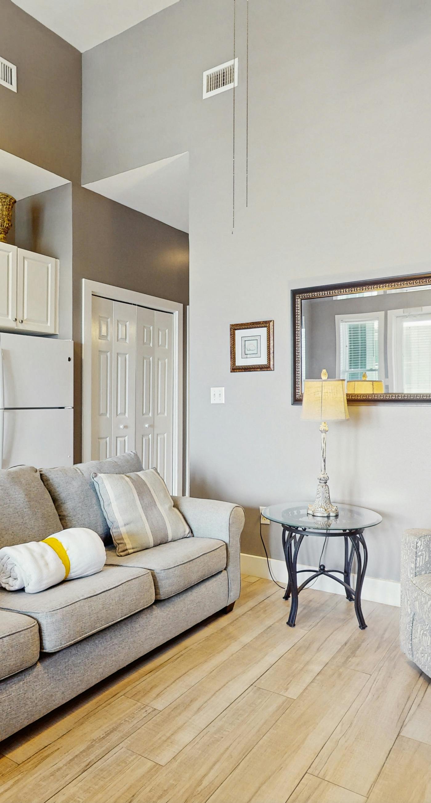 Spacious condo with large living area, private balcony & shared pool