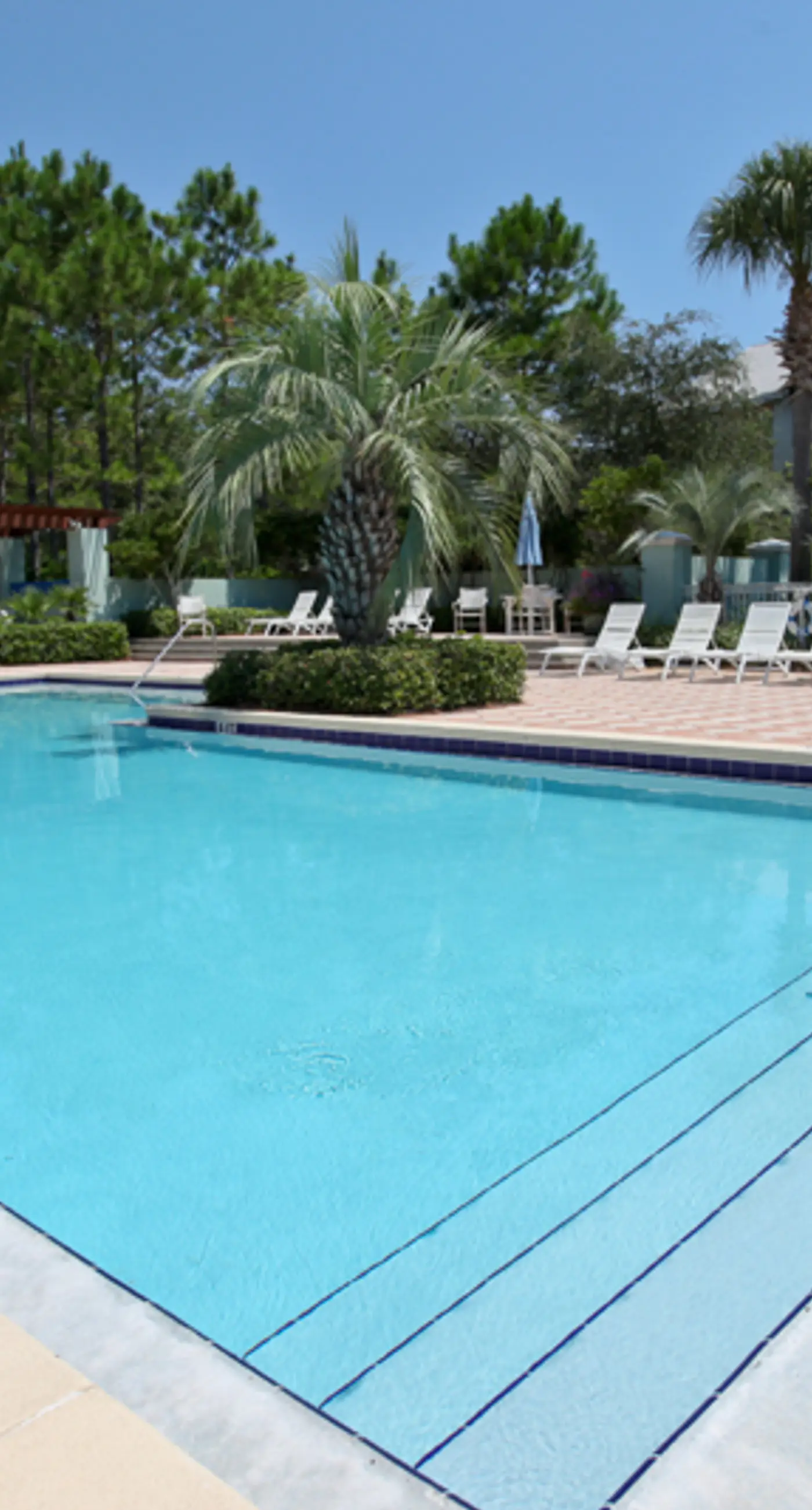 Spacious condo with large living area, private balcony & shared pool