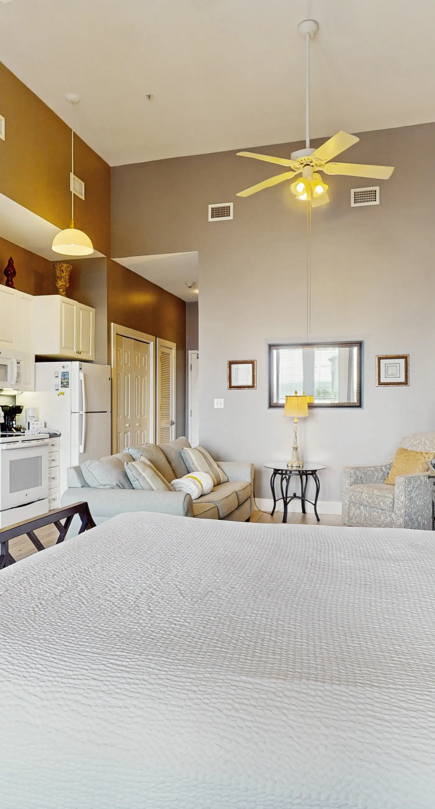 Spacious condo with large living area, private balcony & shared pool