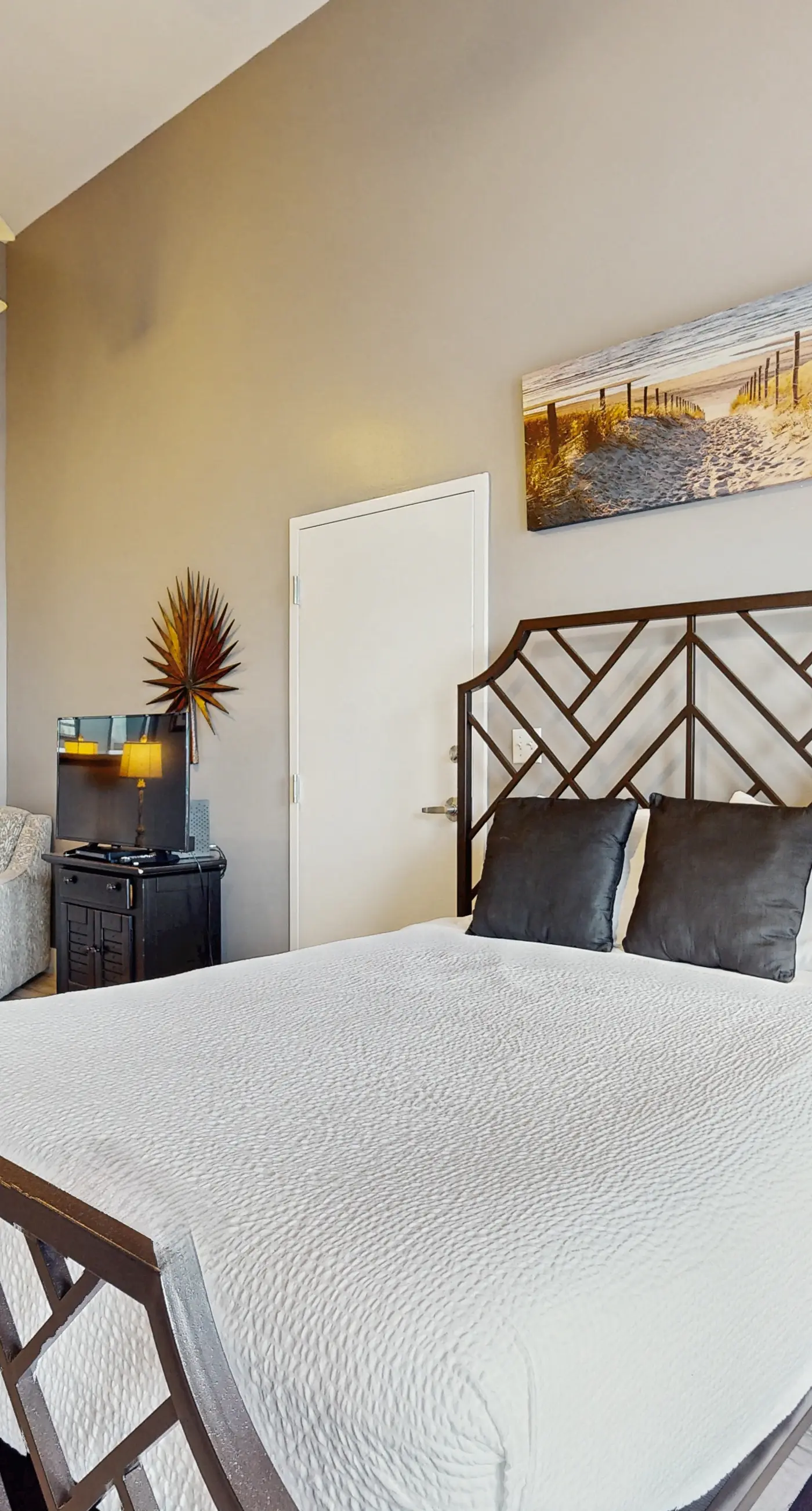 Spacious condo with large living area, private balcony & shared pool