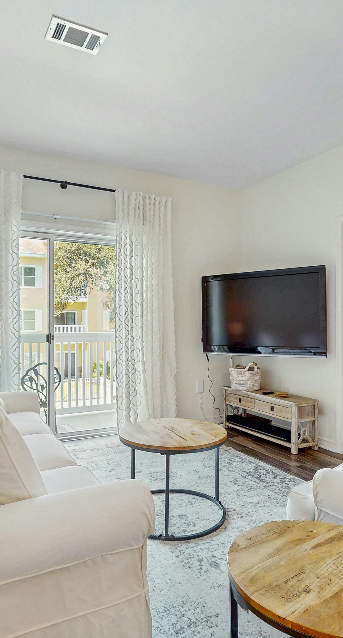 Pool-view condo with private balcony, AC, & washer&dryer