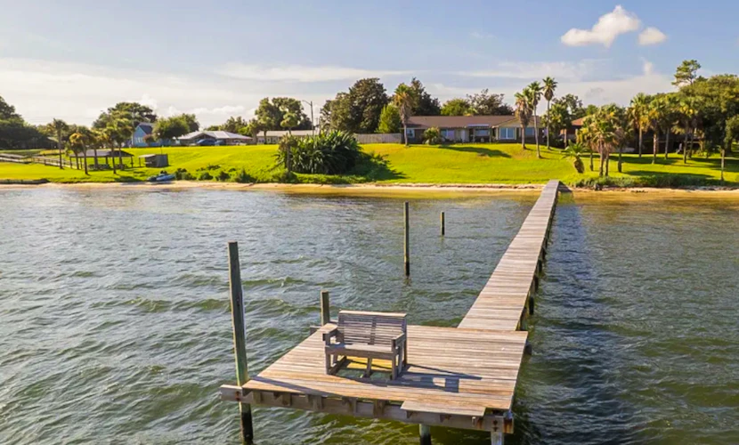 Waterfront pet friendly home with Grill, Hot Tub, Wifi and gorgeous water views.