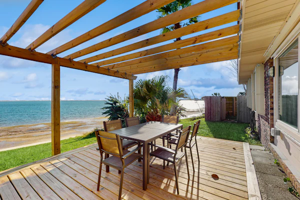 Waterfront pet friendly home with Grill, Hot Tub, Wifi and gorgeous water views.