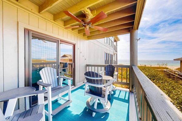 Ideally located coastal condo with Gulf views, private balcony & beach access