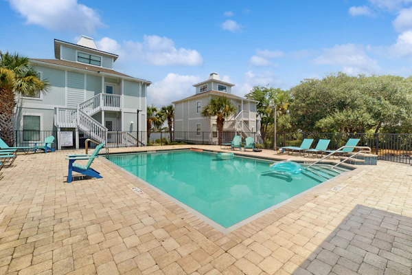 Gorgeous coastal townhome with private balcony/porch, W/D, and shared pool