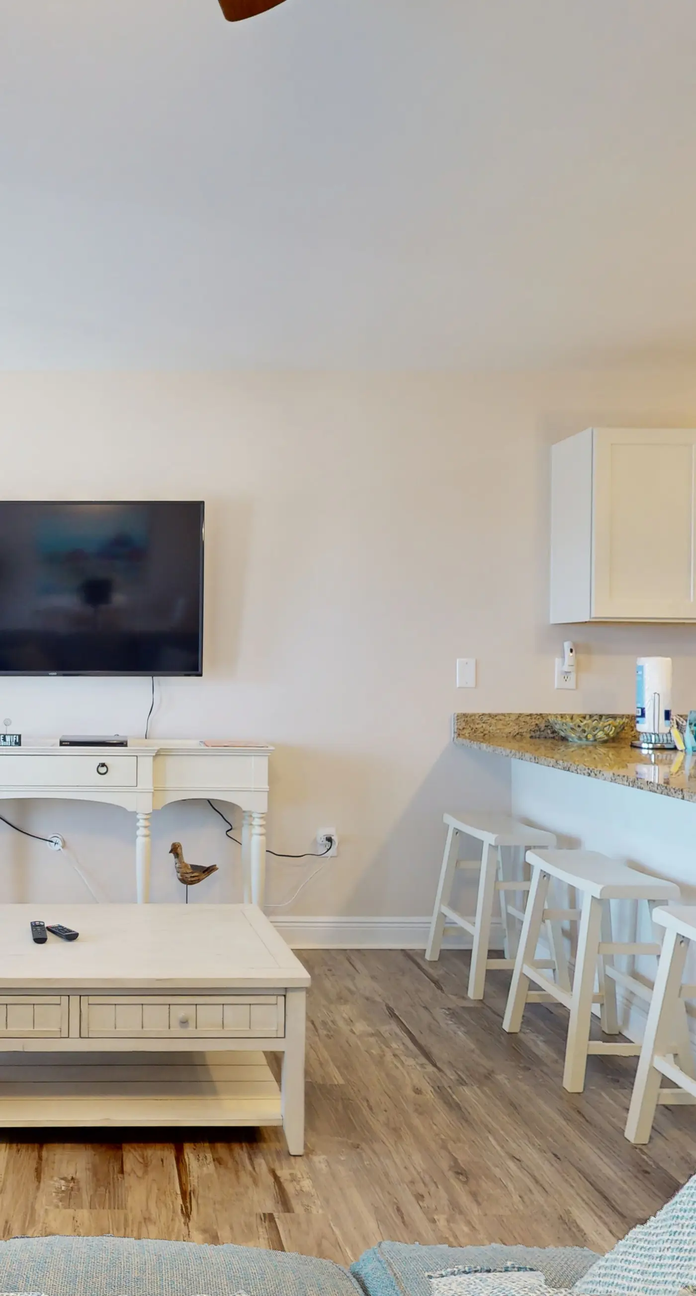 Airy coastal condo steps to the Gulf & quick drive to entertainment