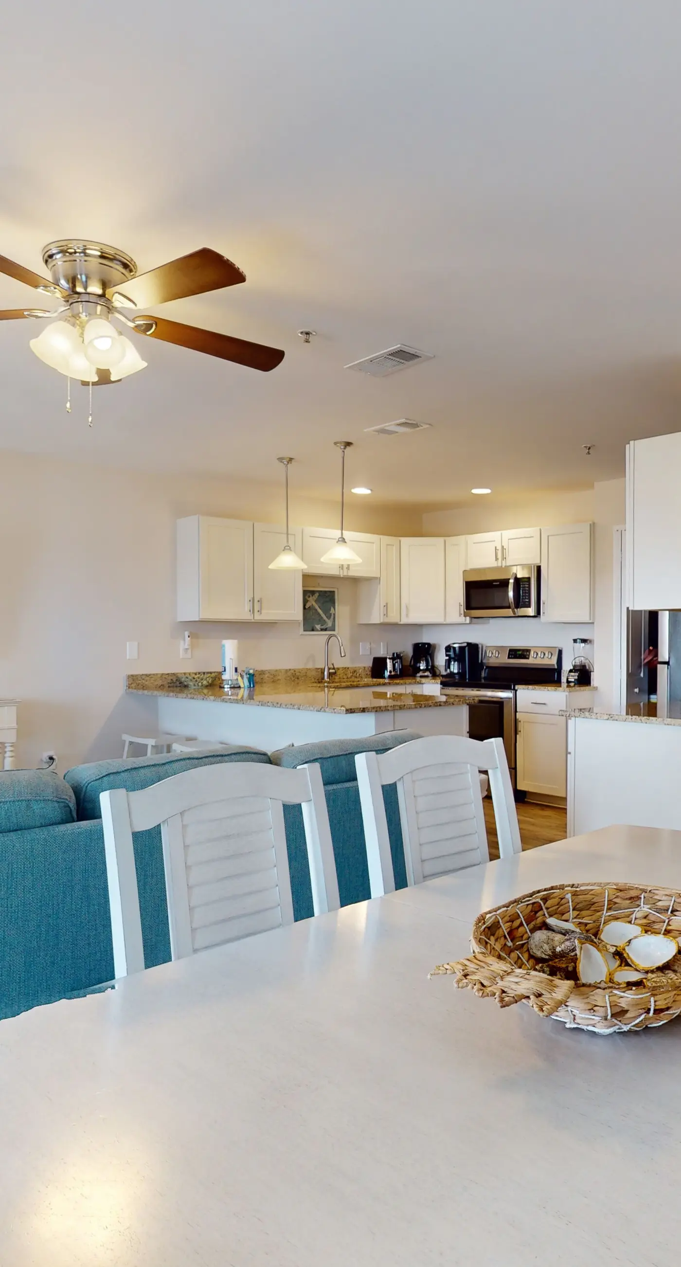 Airy coastal condo steps to the Gulf & quick drive to entertainment