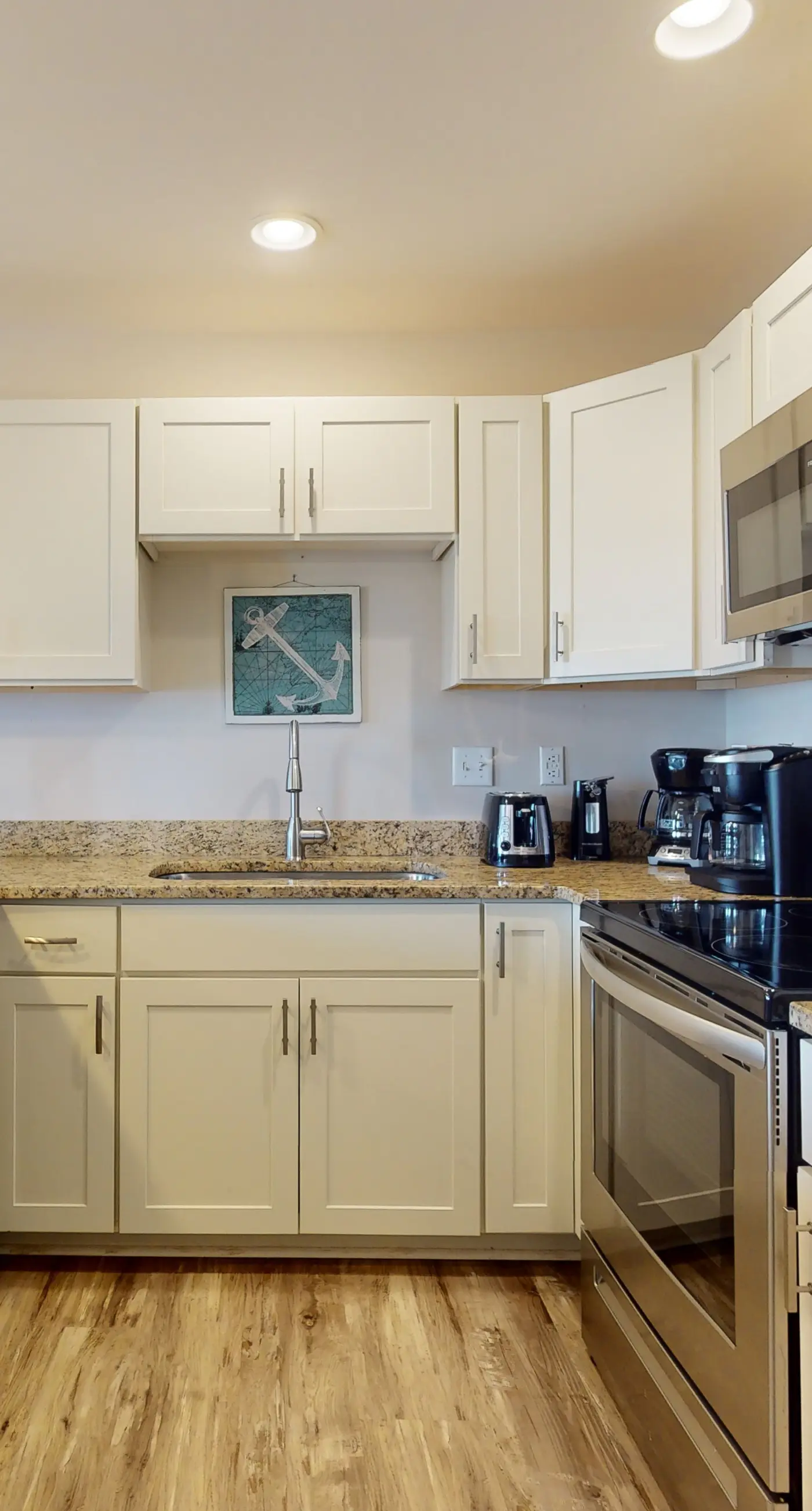 Airy coastal condo steps to the Gulf & quick drive to entertainment