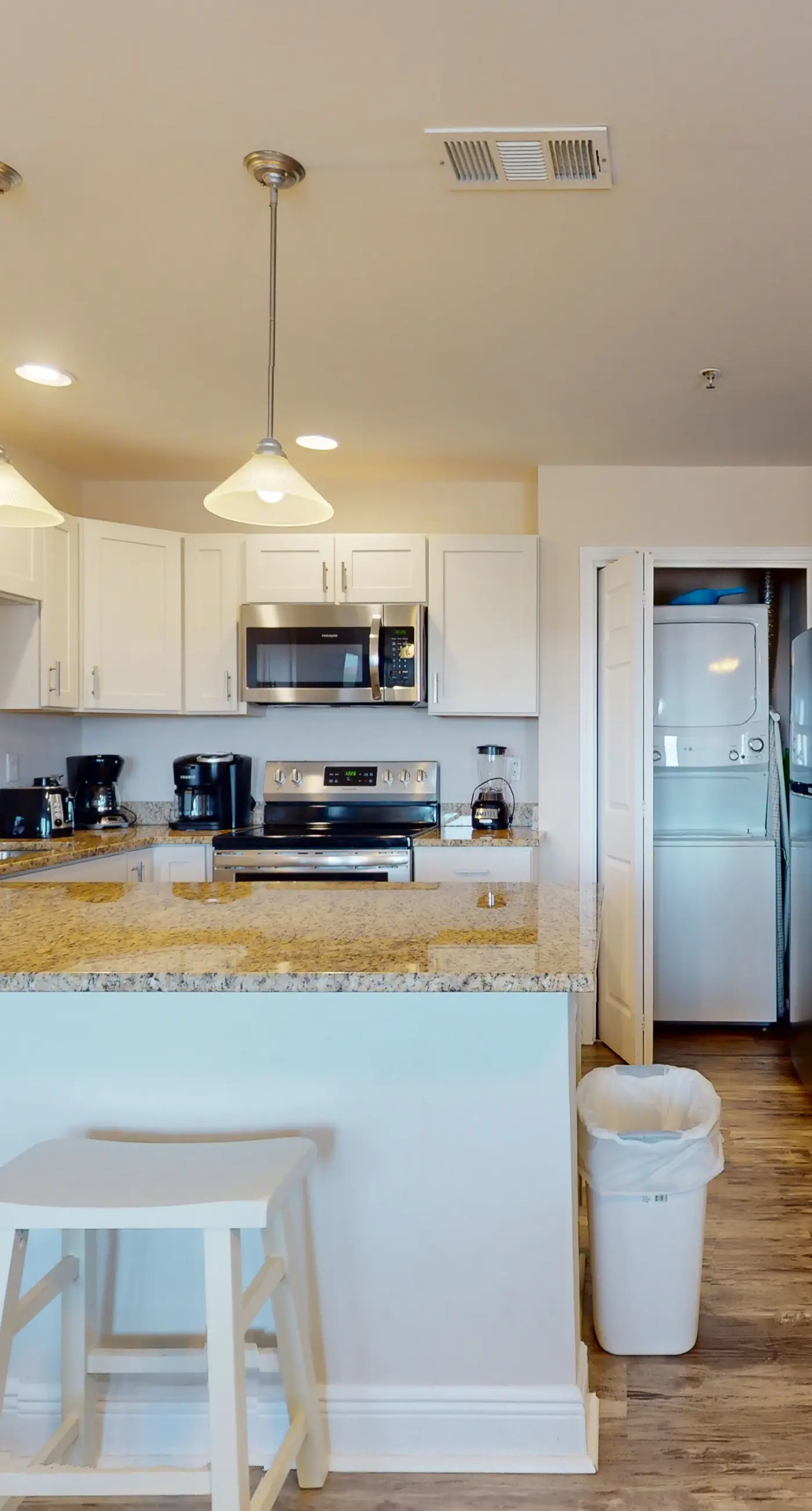 Airy coastal condo steps to the Gulf & quick drive to entertainment