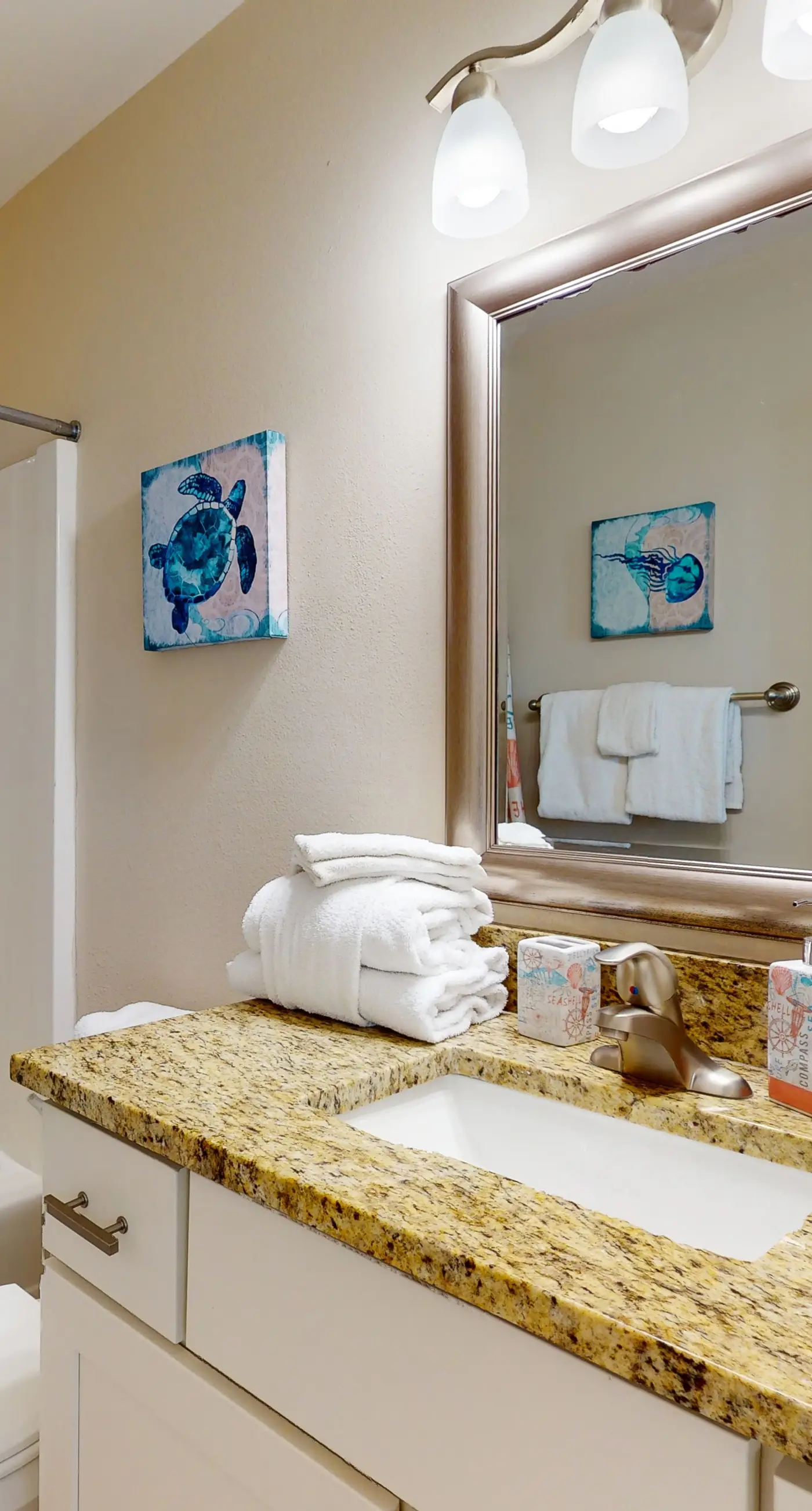 Airy coastal condo steps to the Gulf & quick drive to entertainment