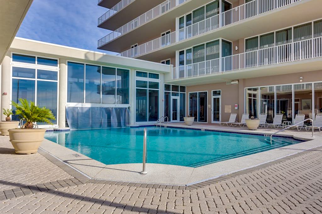 Beachfront 10th-floor condo with Gulf view, pool, gym, & balcony