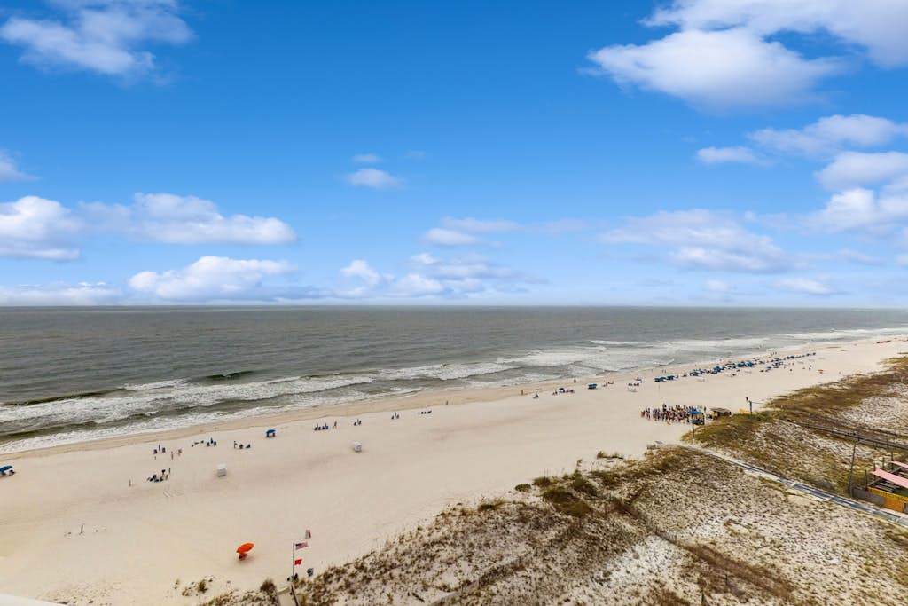 Beachfront 10th-floor condo with Gulf view, pool, gym, & balcony