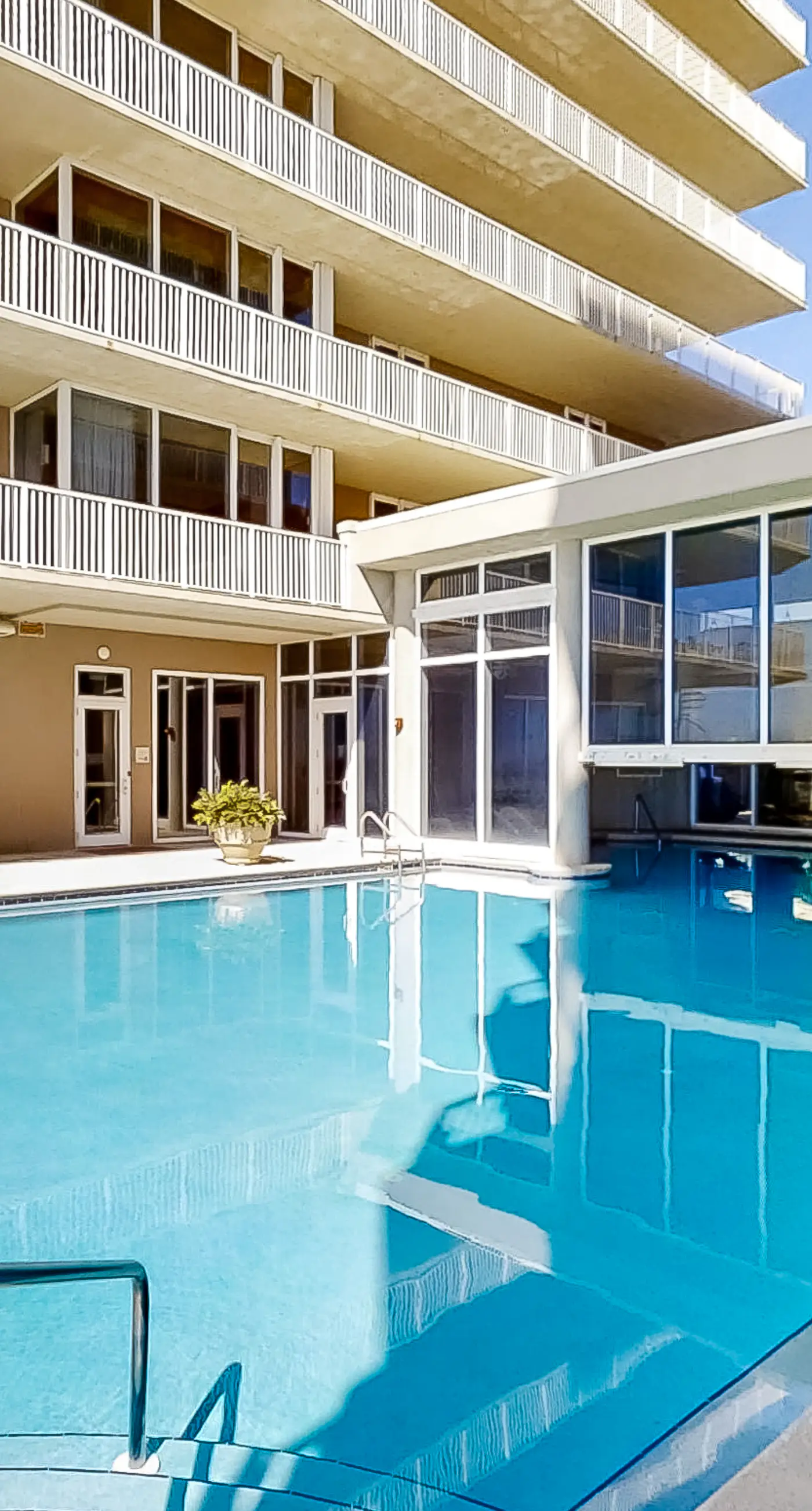 Beachfront 10th-floor condo with Gulf view, pool, gym, & balcony