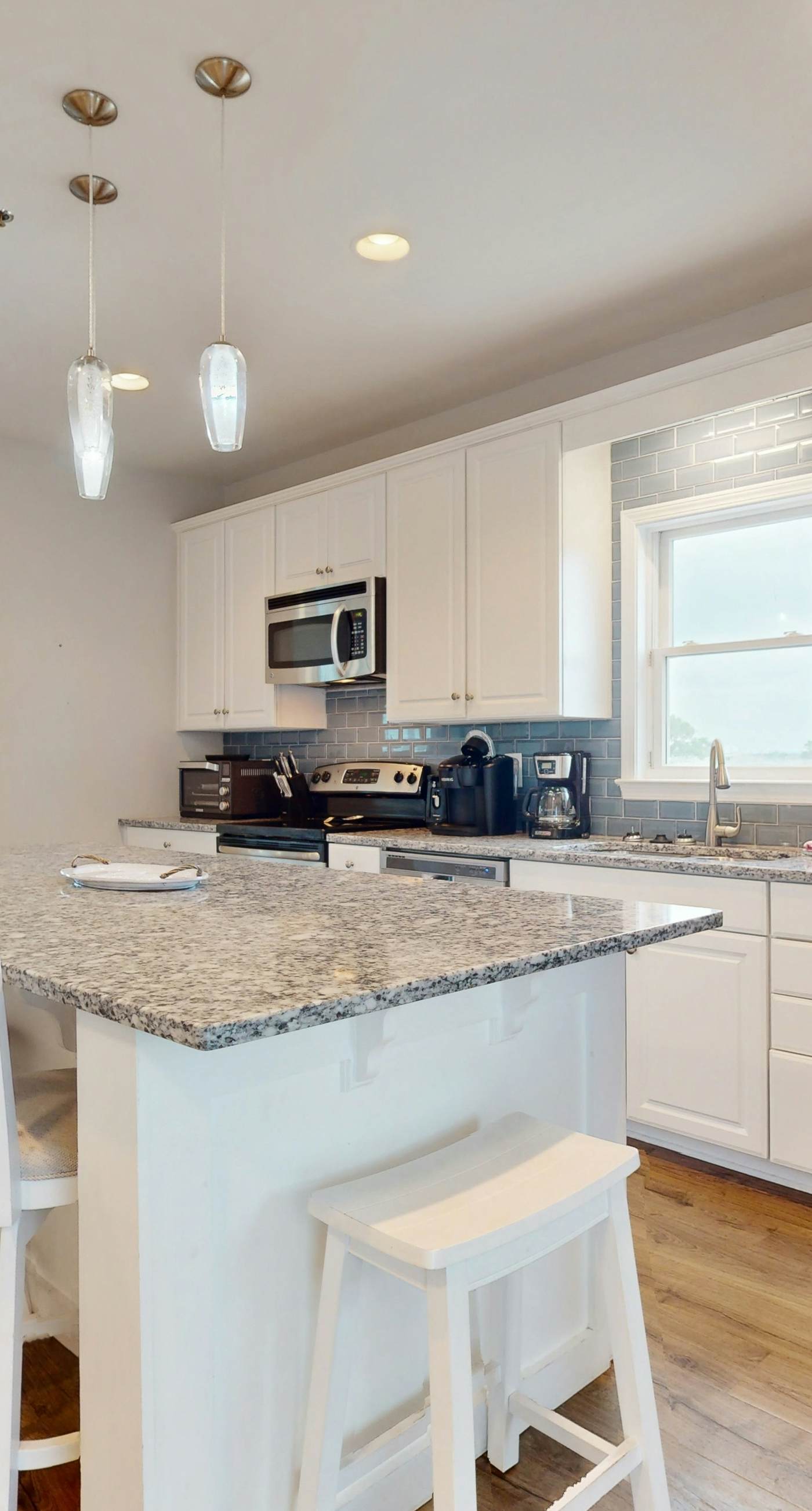 Inviting home with pool, Gulf view, tennis, patio, central AC, & W/D